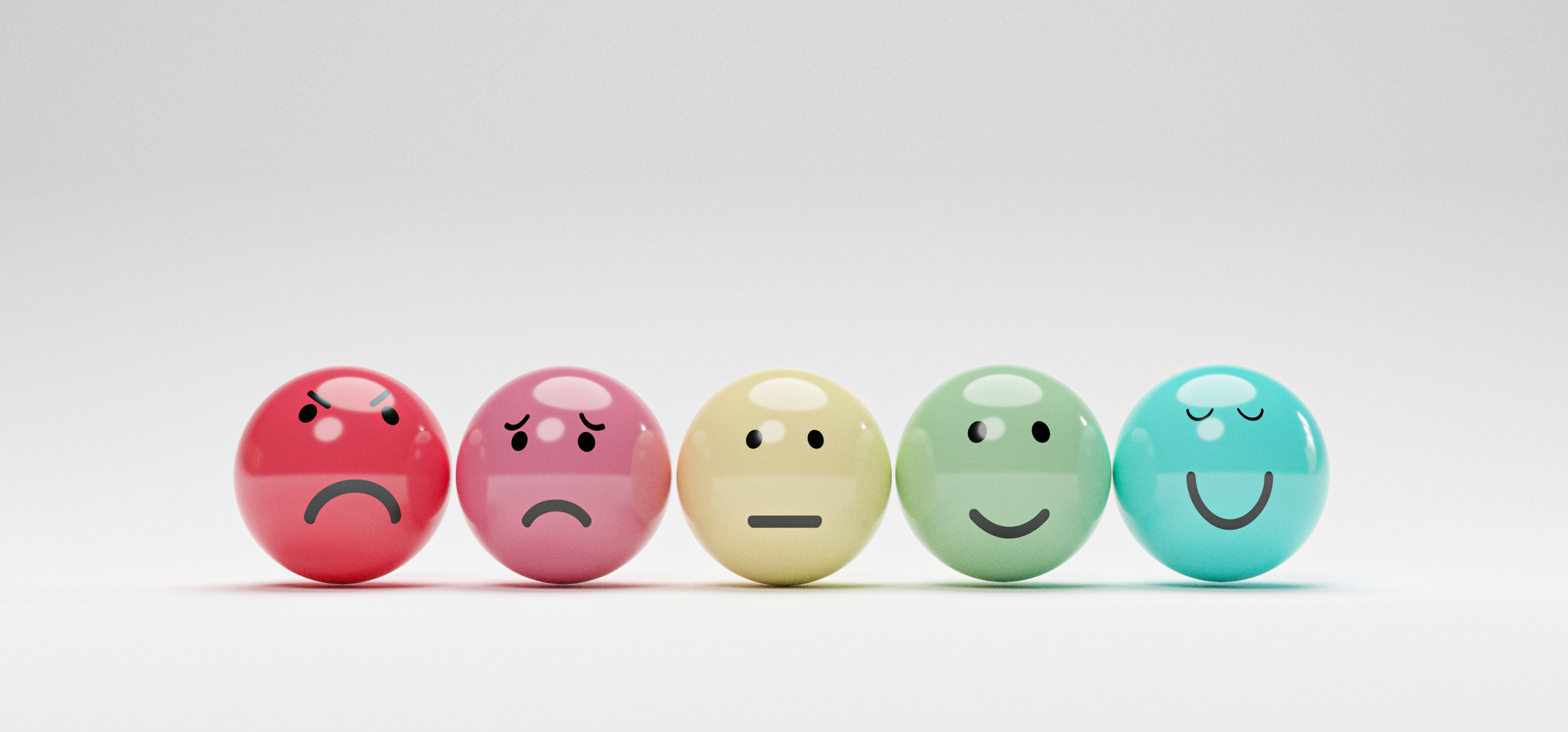 Faces drawn on spheres having different emotions