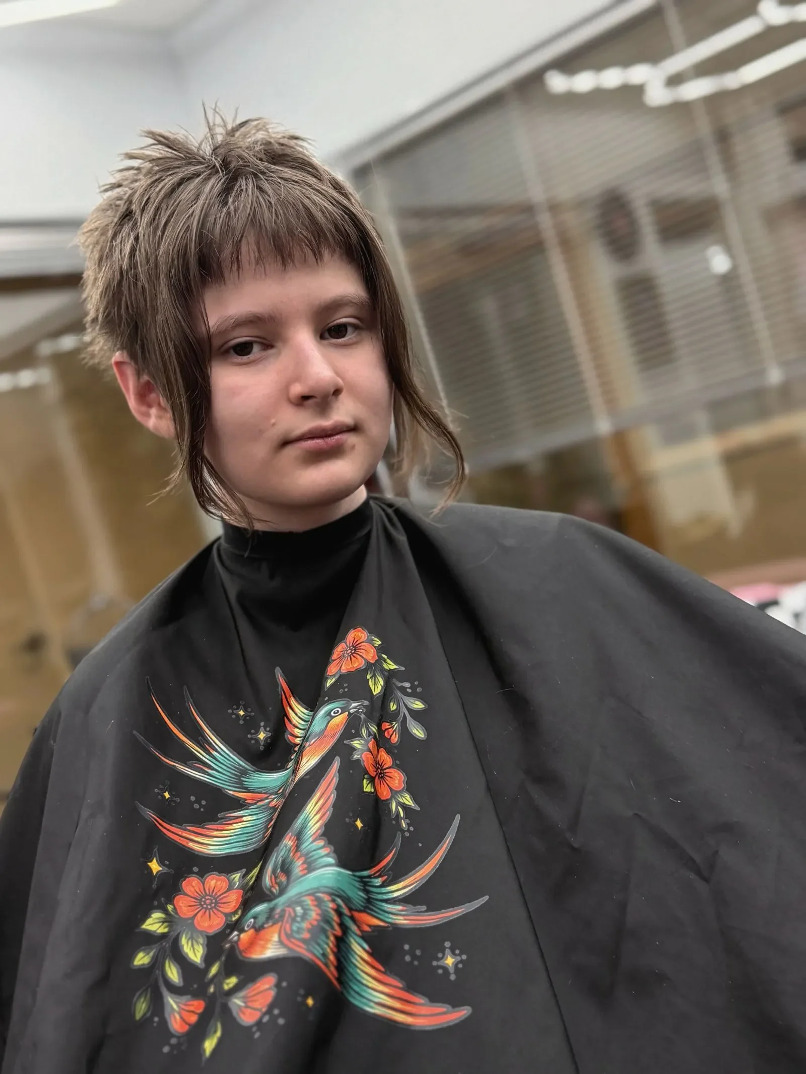 Client showing alternative shag haircuts with face-framing layers and curtain bangs by Brandi Gross at The Panic Room in Rapid City SD.