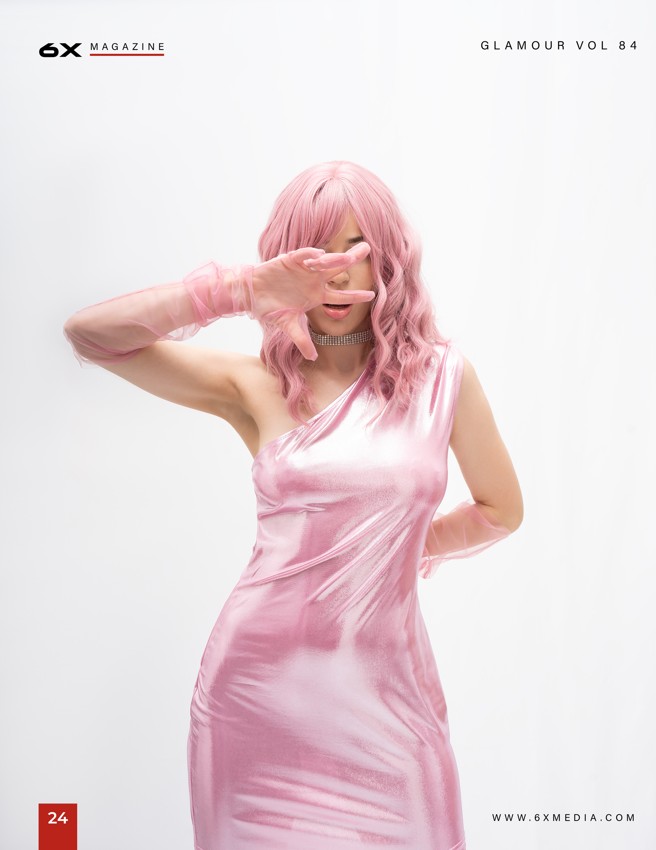 Magazine cover featuring a woman with pink hair in a pink satin dress, wearing pink gloves and a diamond choker, covering one eye with her hand.