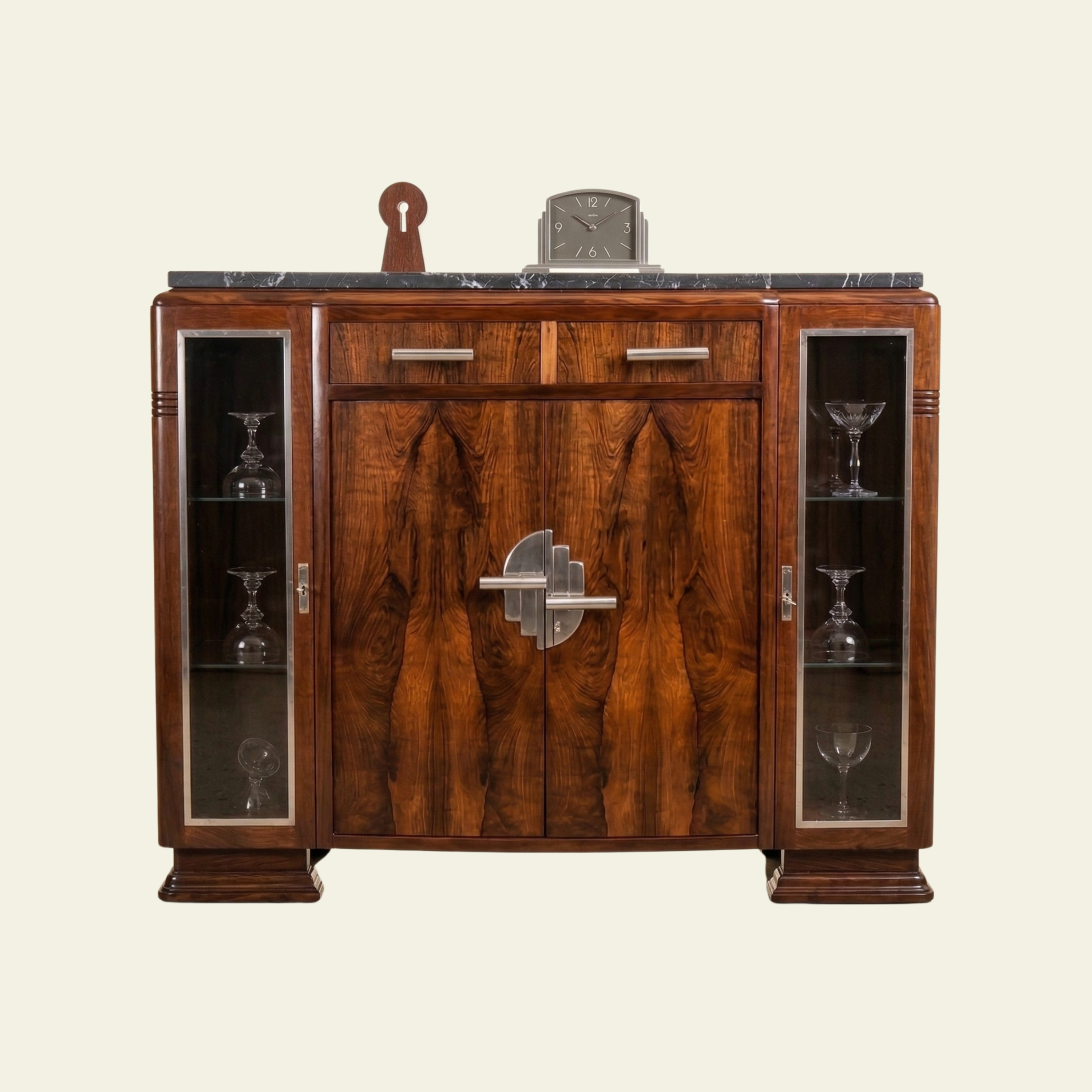French art deco style 1930s vintage wooden sideboard buffet with original glass doors, a marble top, and metallic accents, displaying glassware inside. Beautiful and stunning bookmatched rosewood.
