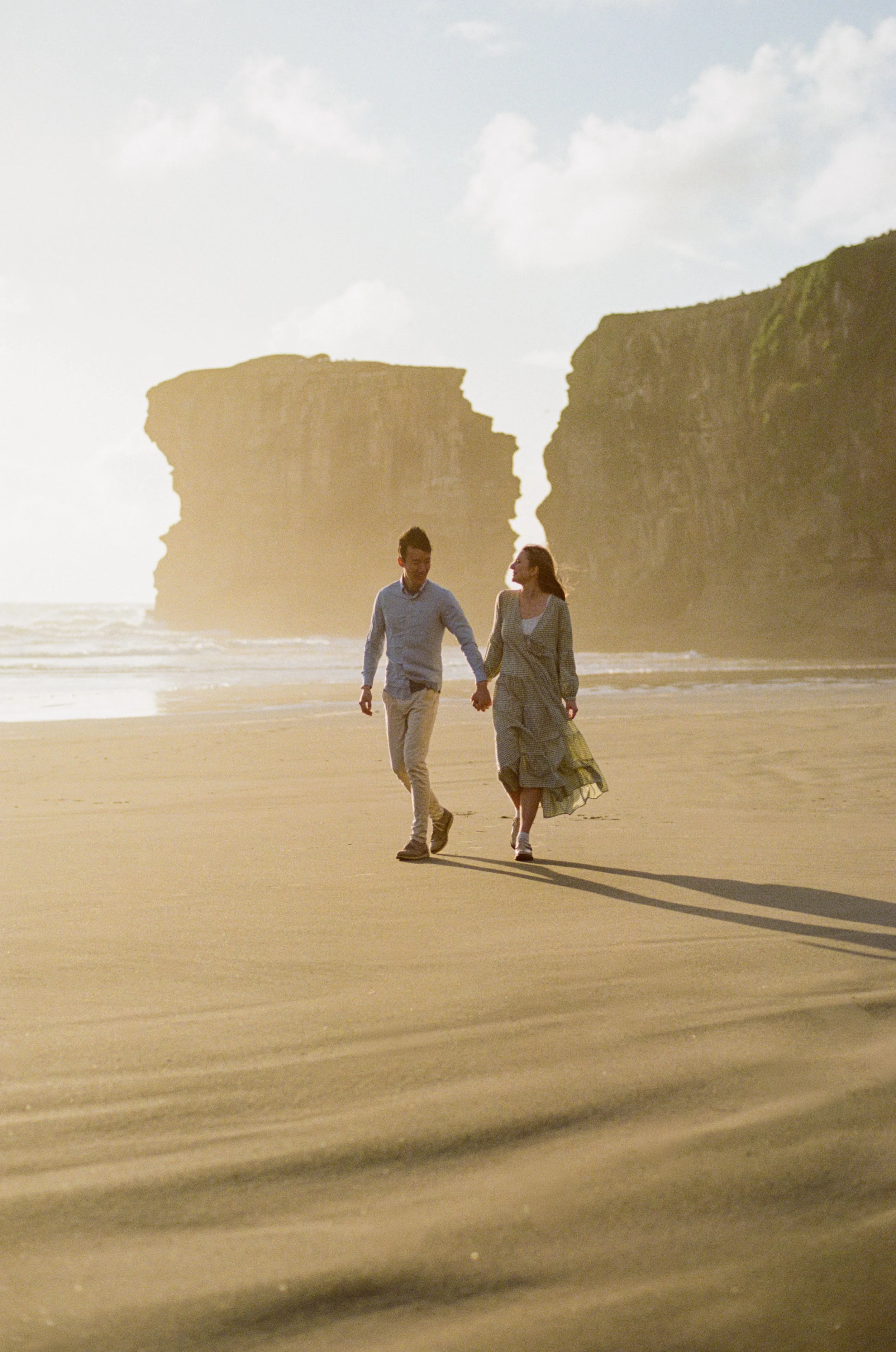 Engagement photoshoot at the beach at sunset. Natural setting, beautiful photo. Captured at Muriwai in Auckland, New Zealand. Professional couple photography. Wedding photography. Auckland Wedding photographer. Wedding photographer Melbourne.