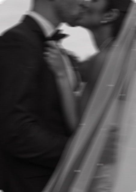 A man in a tuxedo playing a piano.