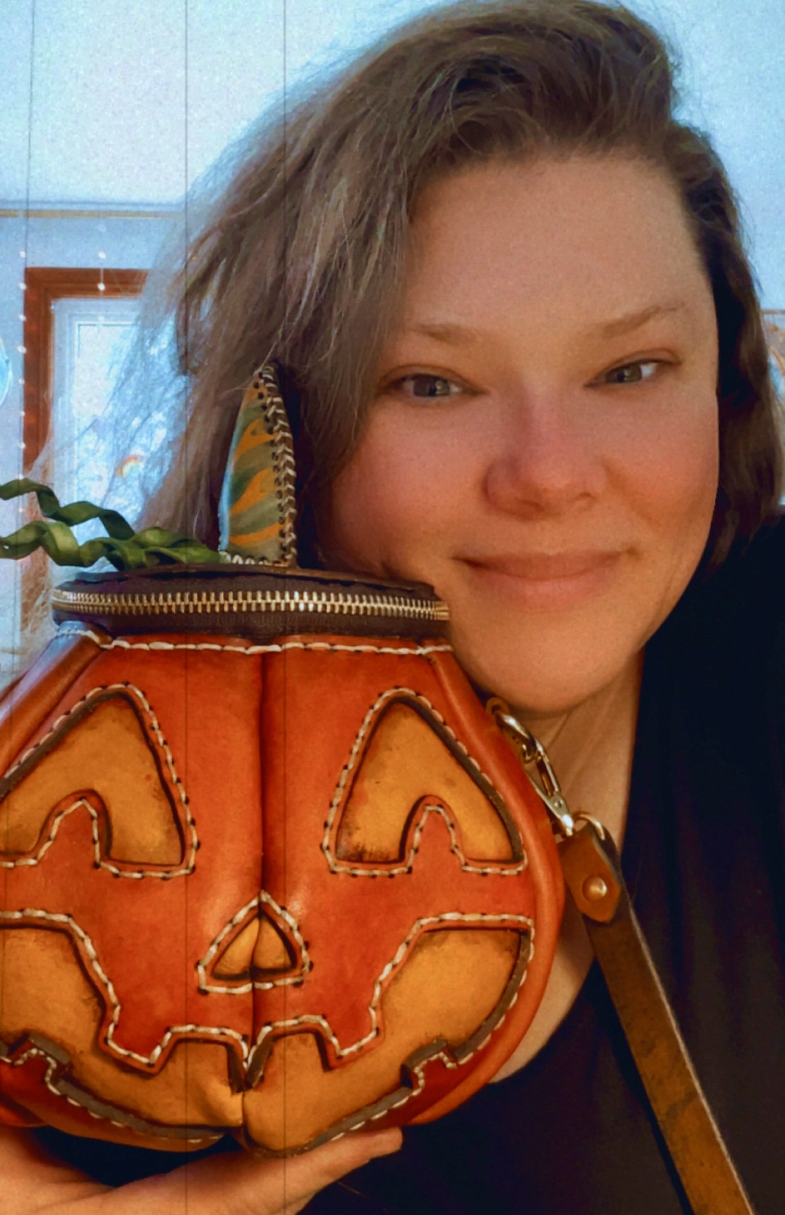 The Great Pumpkin bag shown with a smiling Brandy, the maker and shop owner