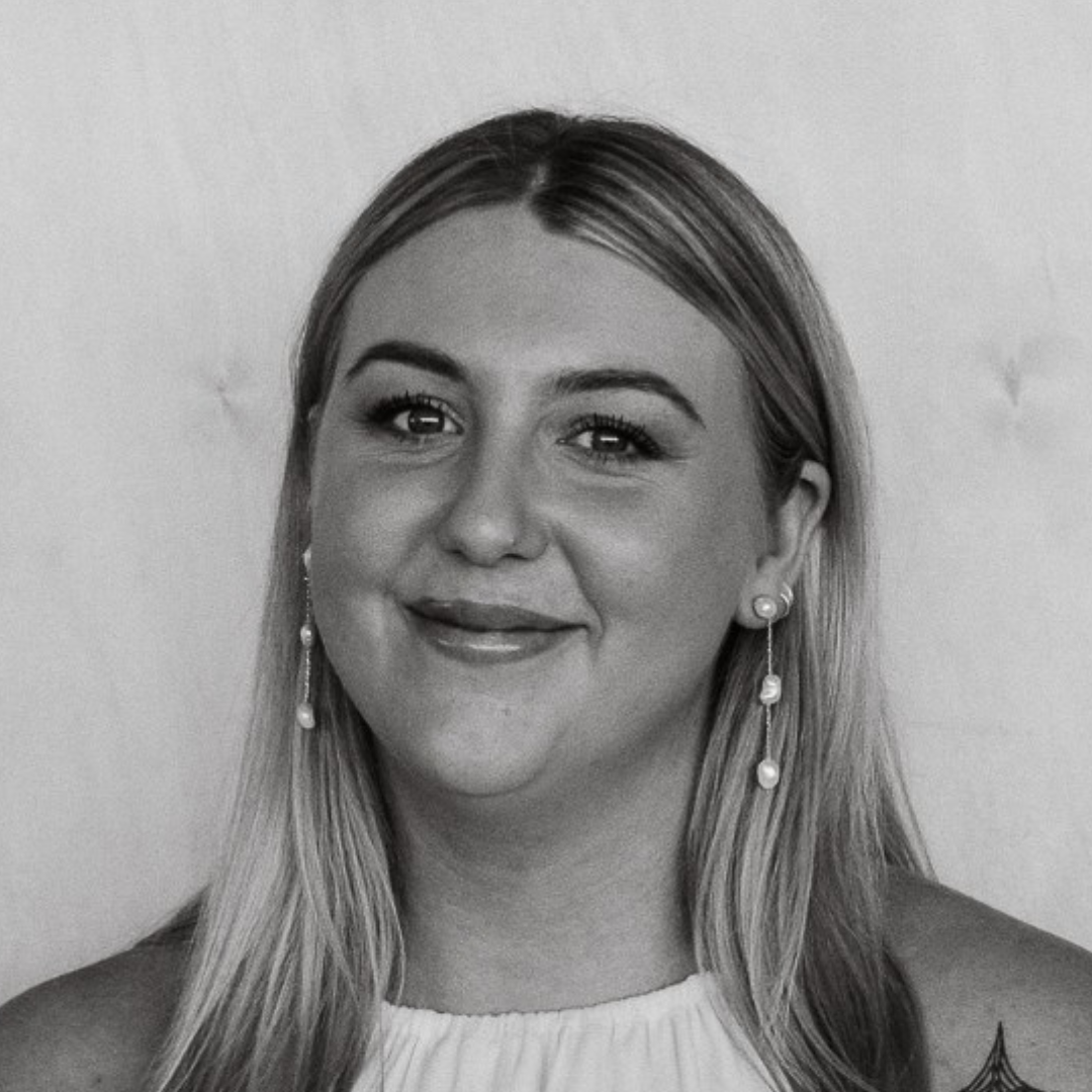 Black-and-white portrait of ELLA TRAPNELL. Design Lead of BRANDID MEDIA GROUP