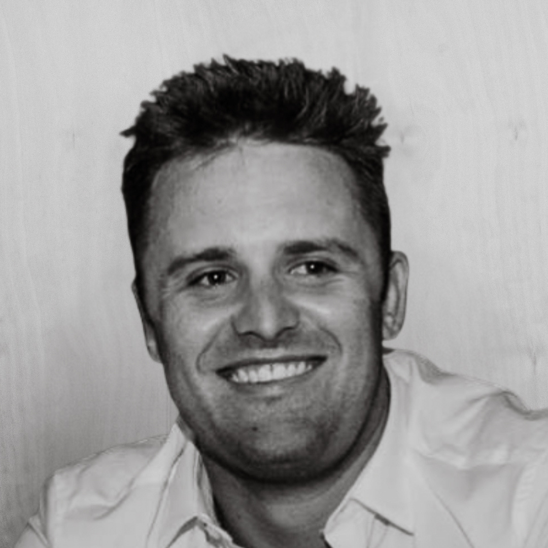 Black and white portrait of JOSH ALLEN. Managing Director of BRANDID MEDIA GROUP