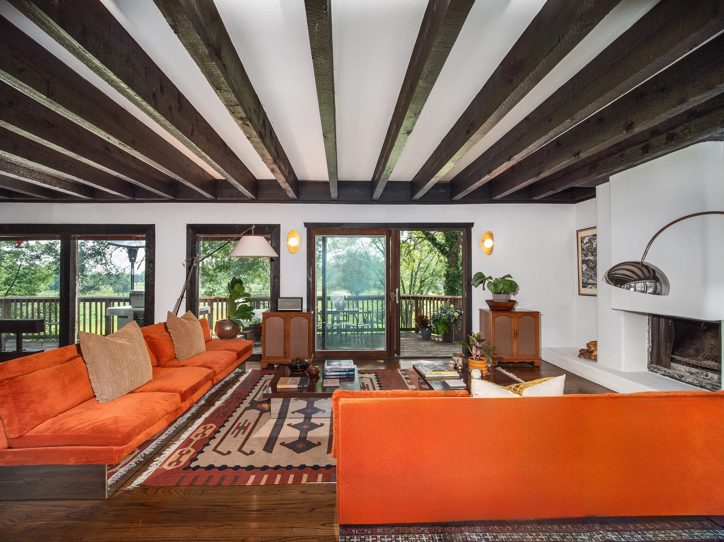 Milos Baughman sofa and custom fireplace