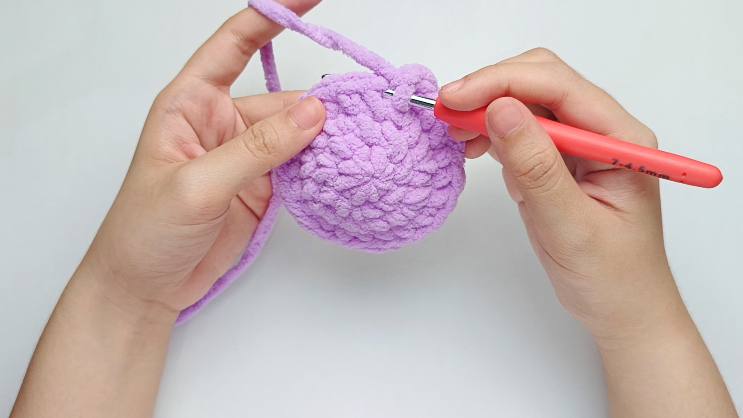 Hook back in: Insert your hook into that marked stitch to begin Round 5. Remove the stitch marker so the stitch is easier to work into.