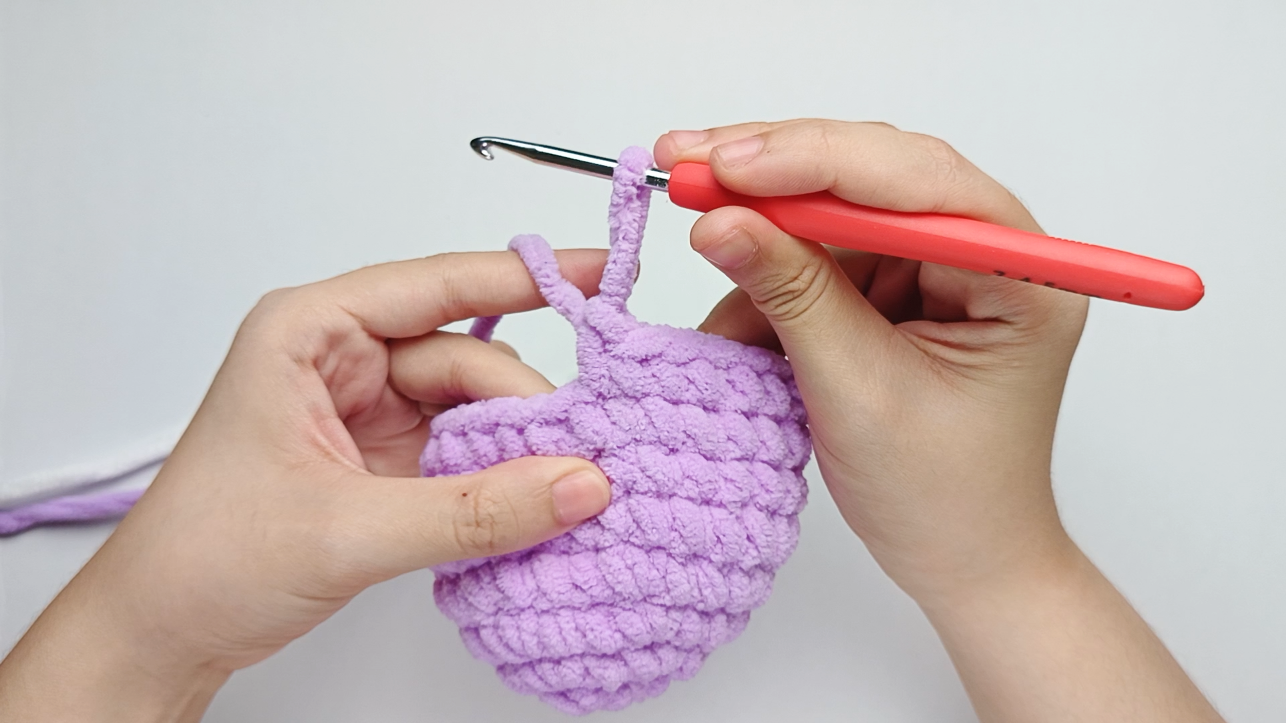 Make 1 single crochet (sc) first: Yarn over, pull through, yarn over again, and pull through both loops.