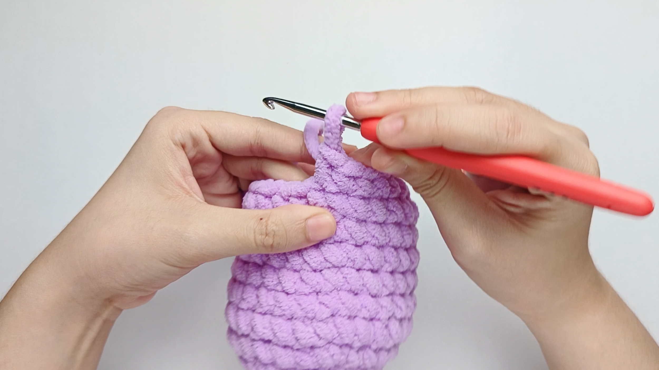 Make 1 single crochet (sc) first: Yarn over, pull through, yarn over again, and pull through both loops.
