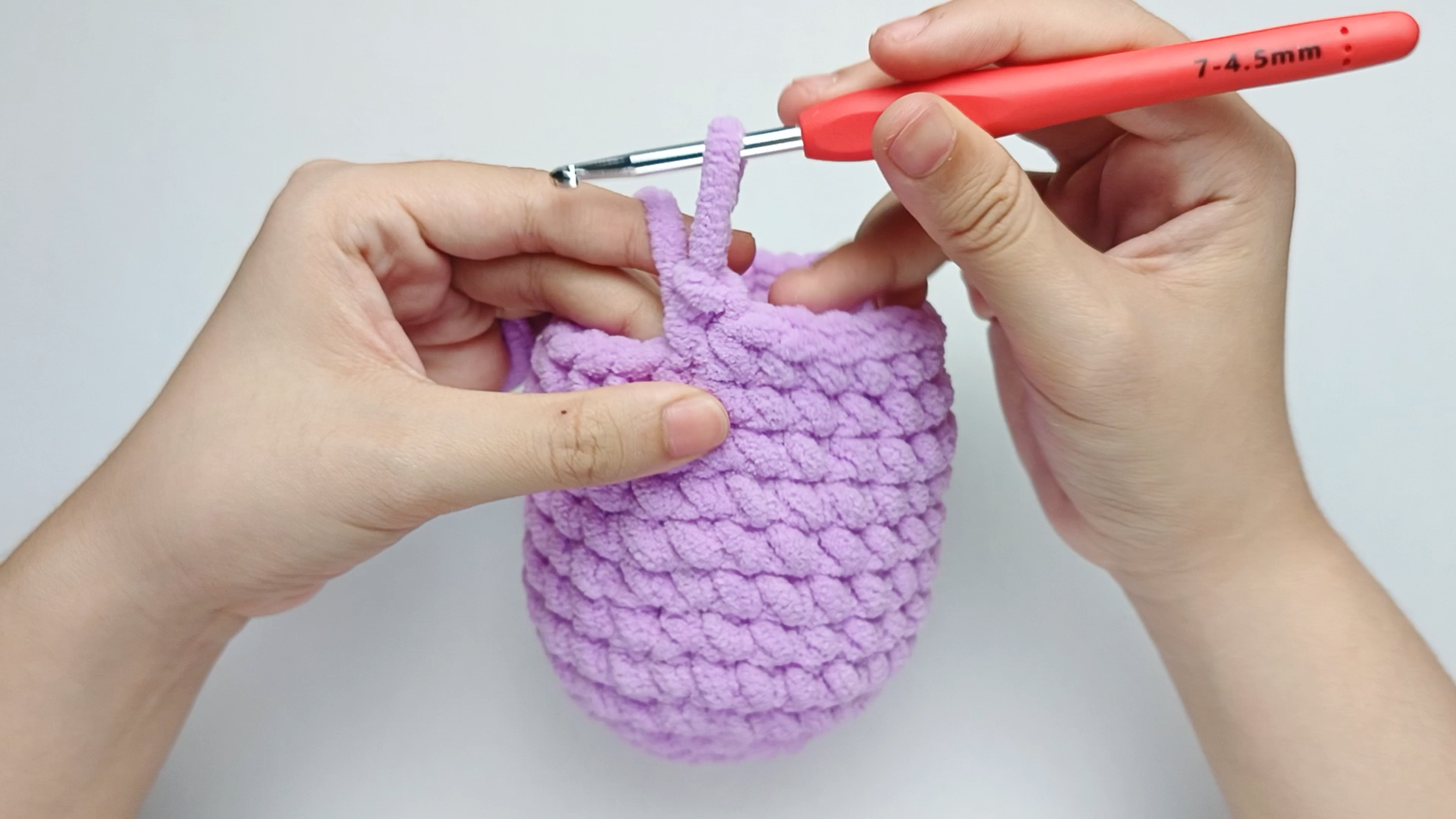 Make 1 single crochet (sc) first: Yarn over, pull through, yarn over again, and pull through both loops.