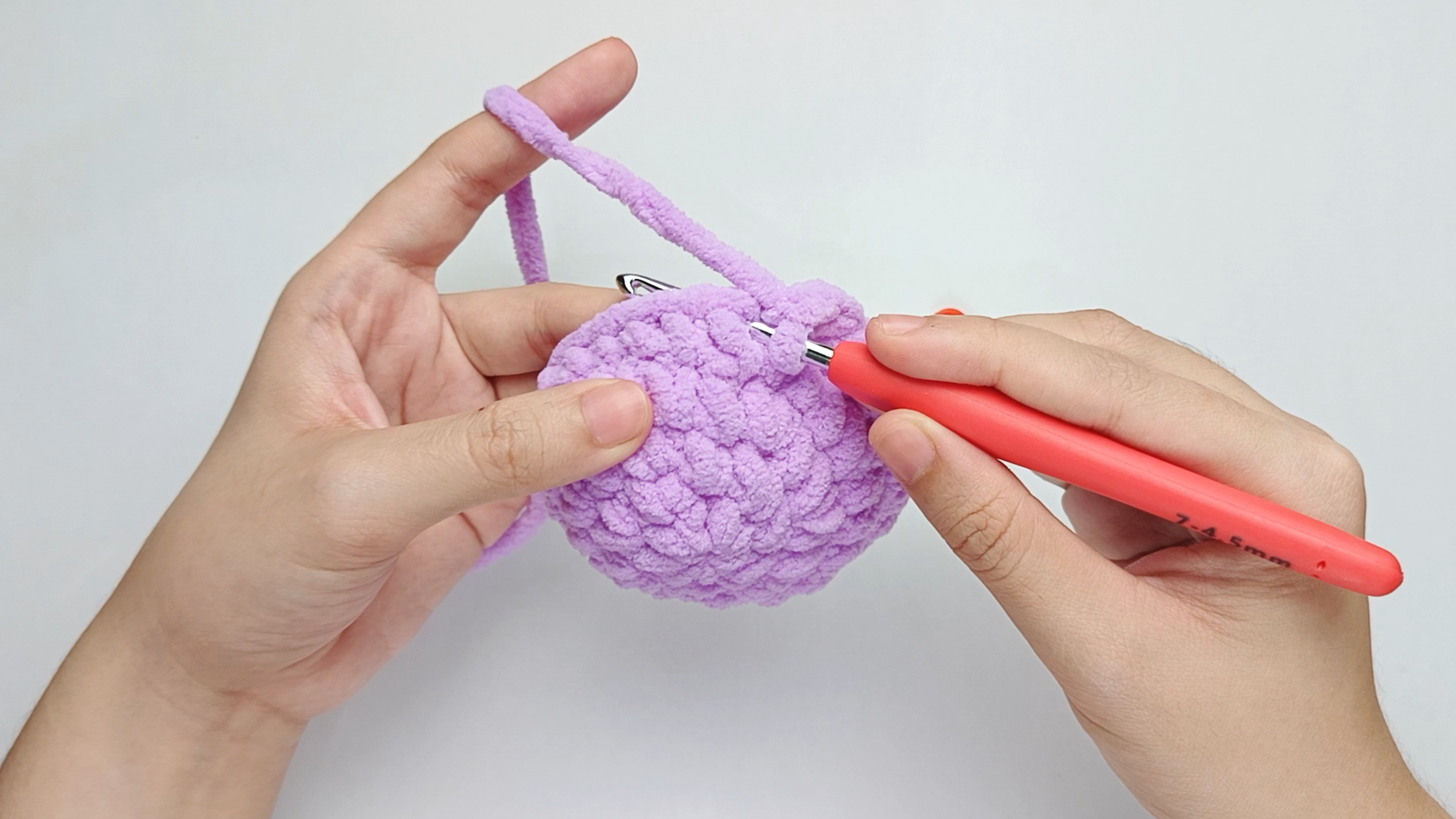 Hook back in: Insert your hook into that marked stitch to begin Round 6. Remove the stitch marker so the stitch is easier to work into.