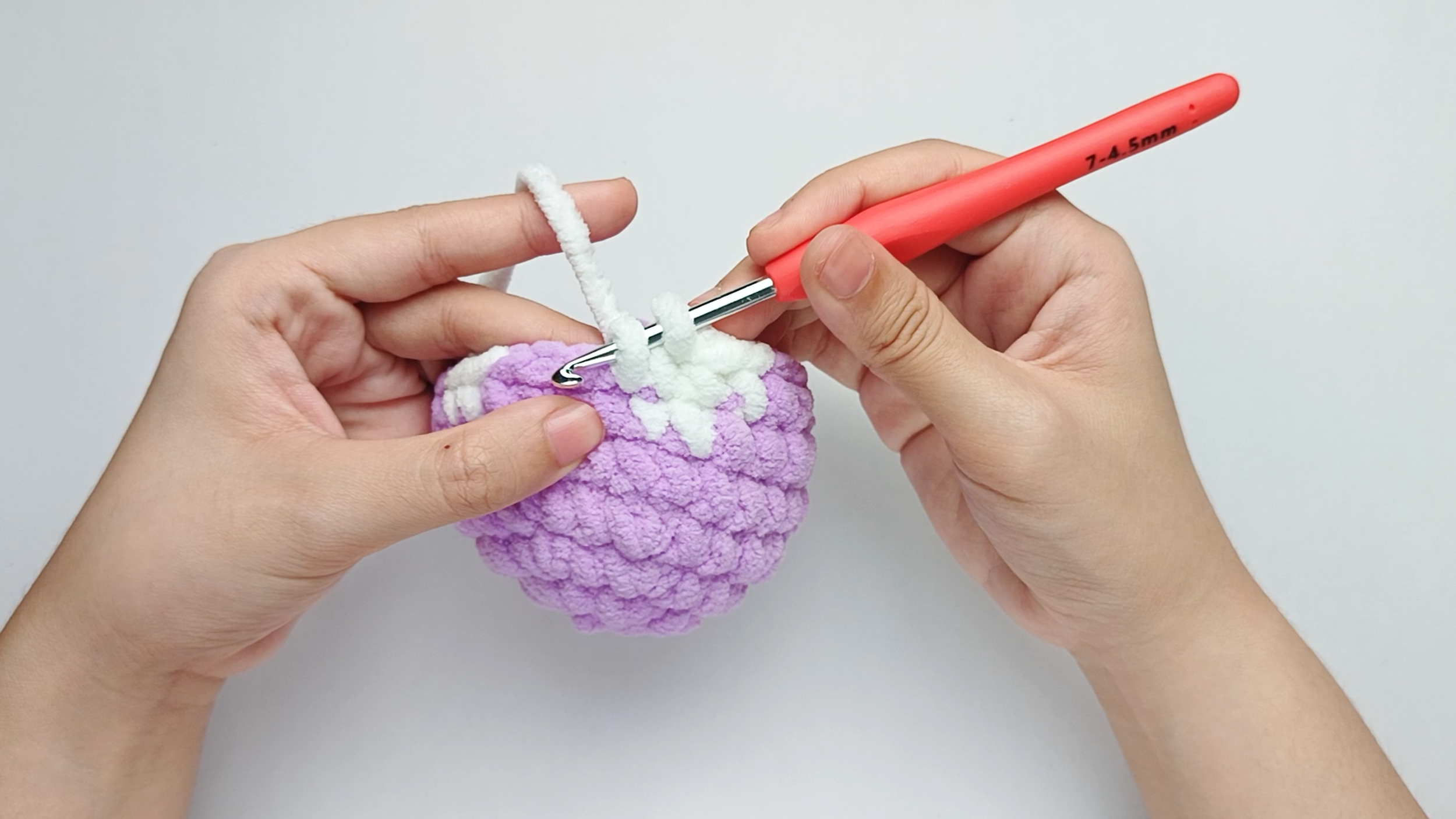 Make 4 white single crochets (sc): Color change to white, make 4 white single crochets (sc), and stop just before the final yarn over.