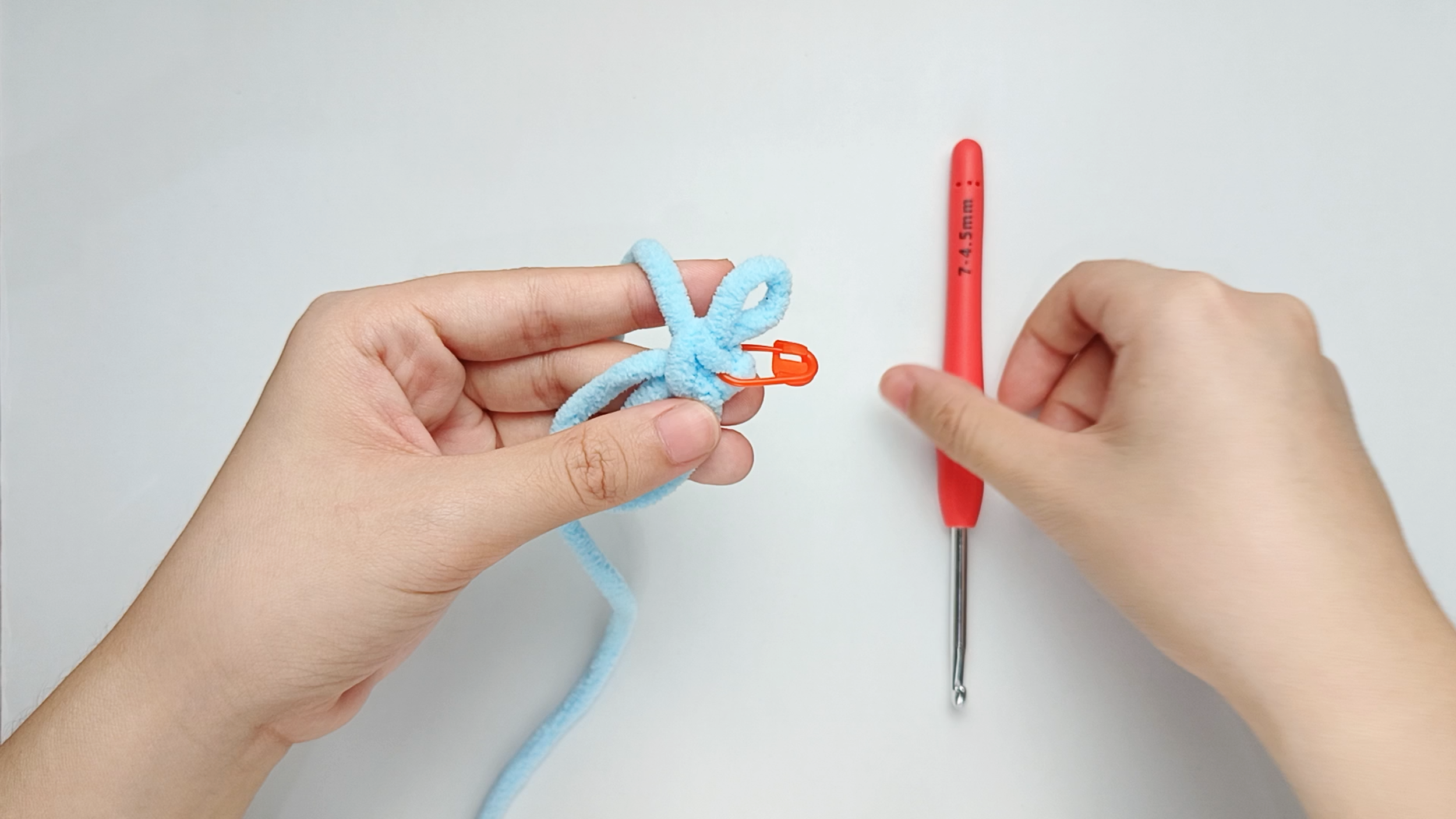 Mark the first stitch: Remove your hook for a moment, and use the stitch marker to mark this first stitch.