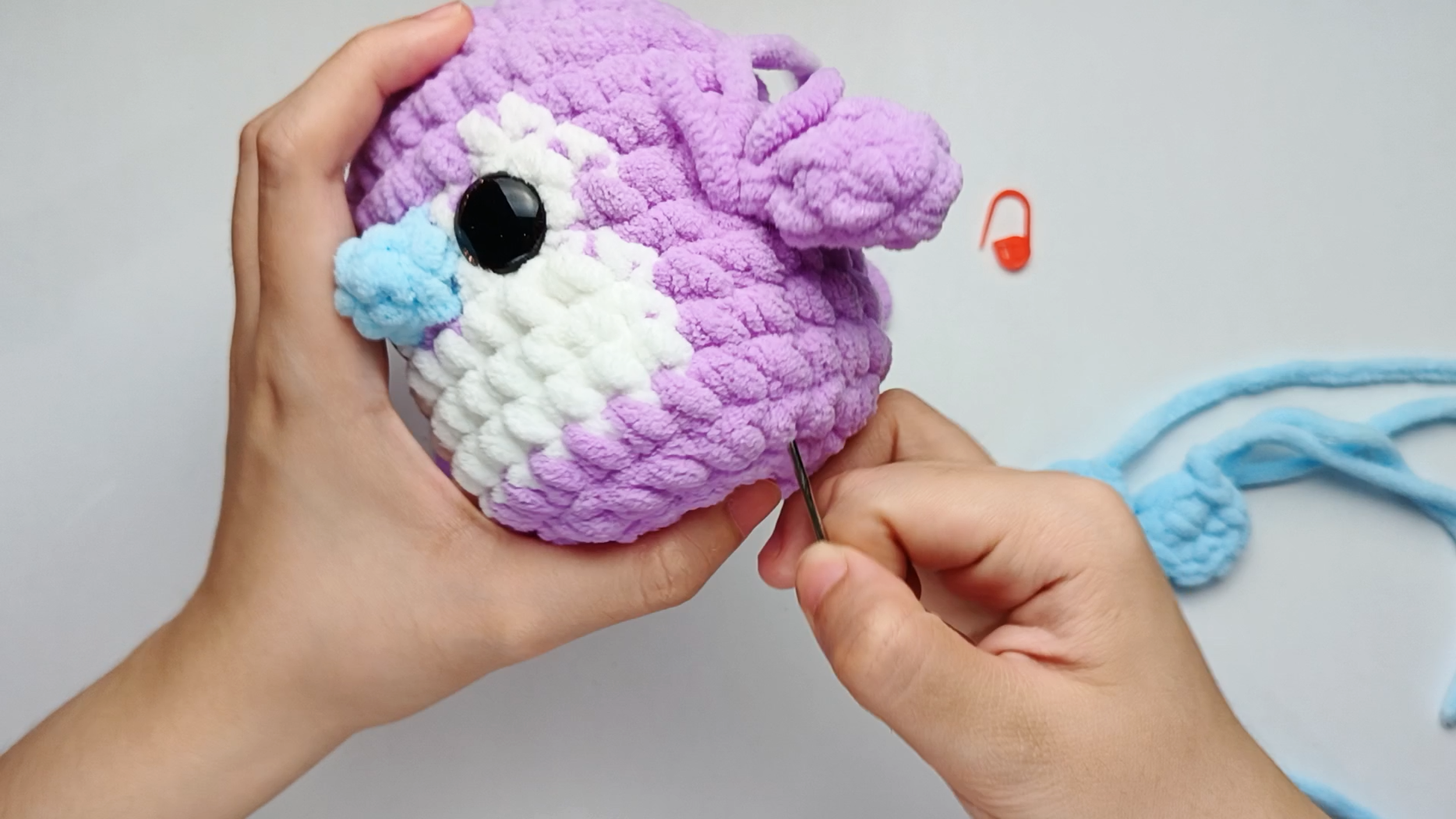 Secure and hide the tail: To hide the yarn tail, take the needle down into the next stitch and run it through the Body, then pull the yarn through.