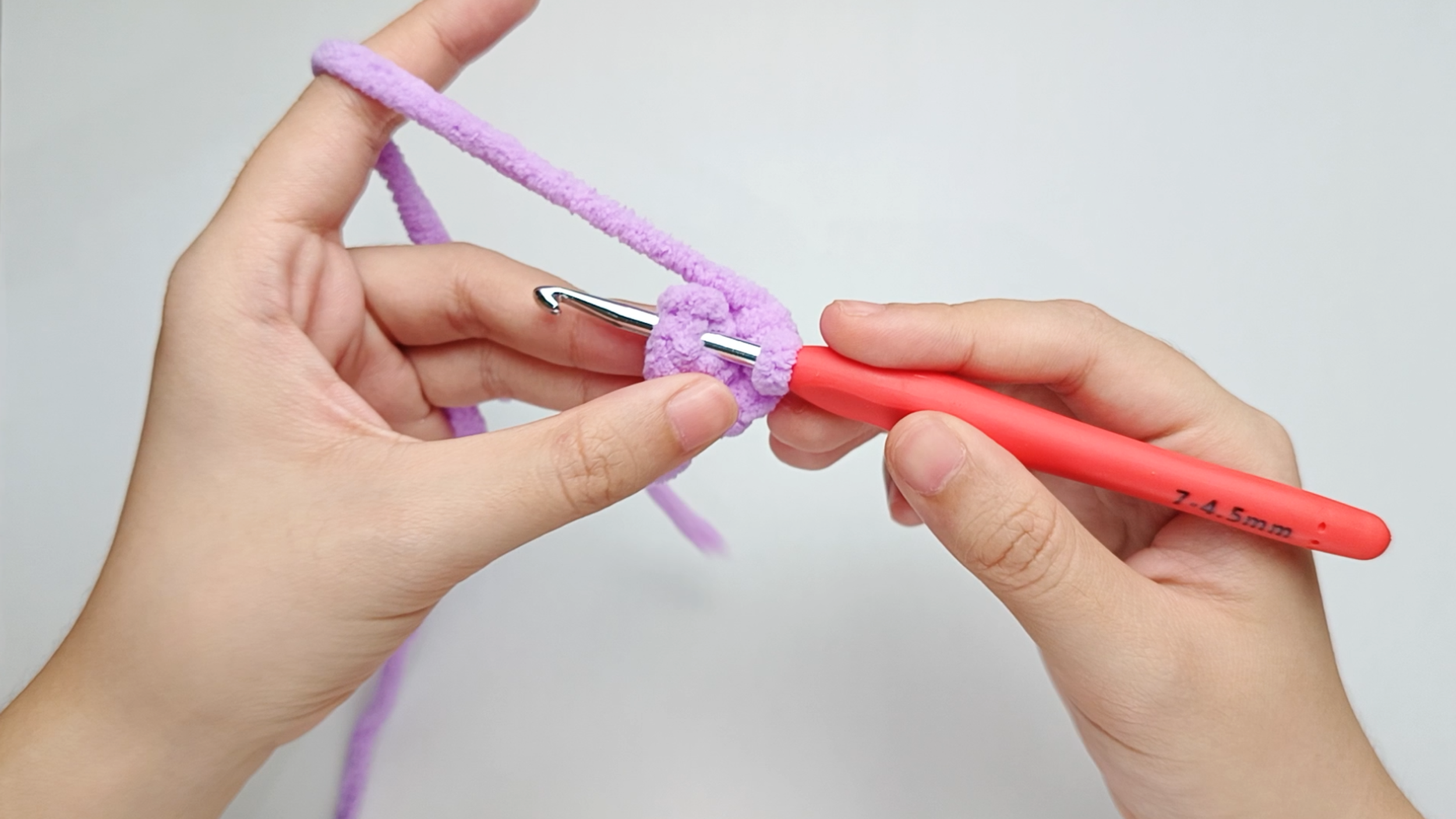 Hook back in: Insert your hook into that marked stitch to begin Round 2. Remove the stitch marker so the stitch is easier to work into.