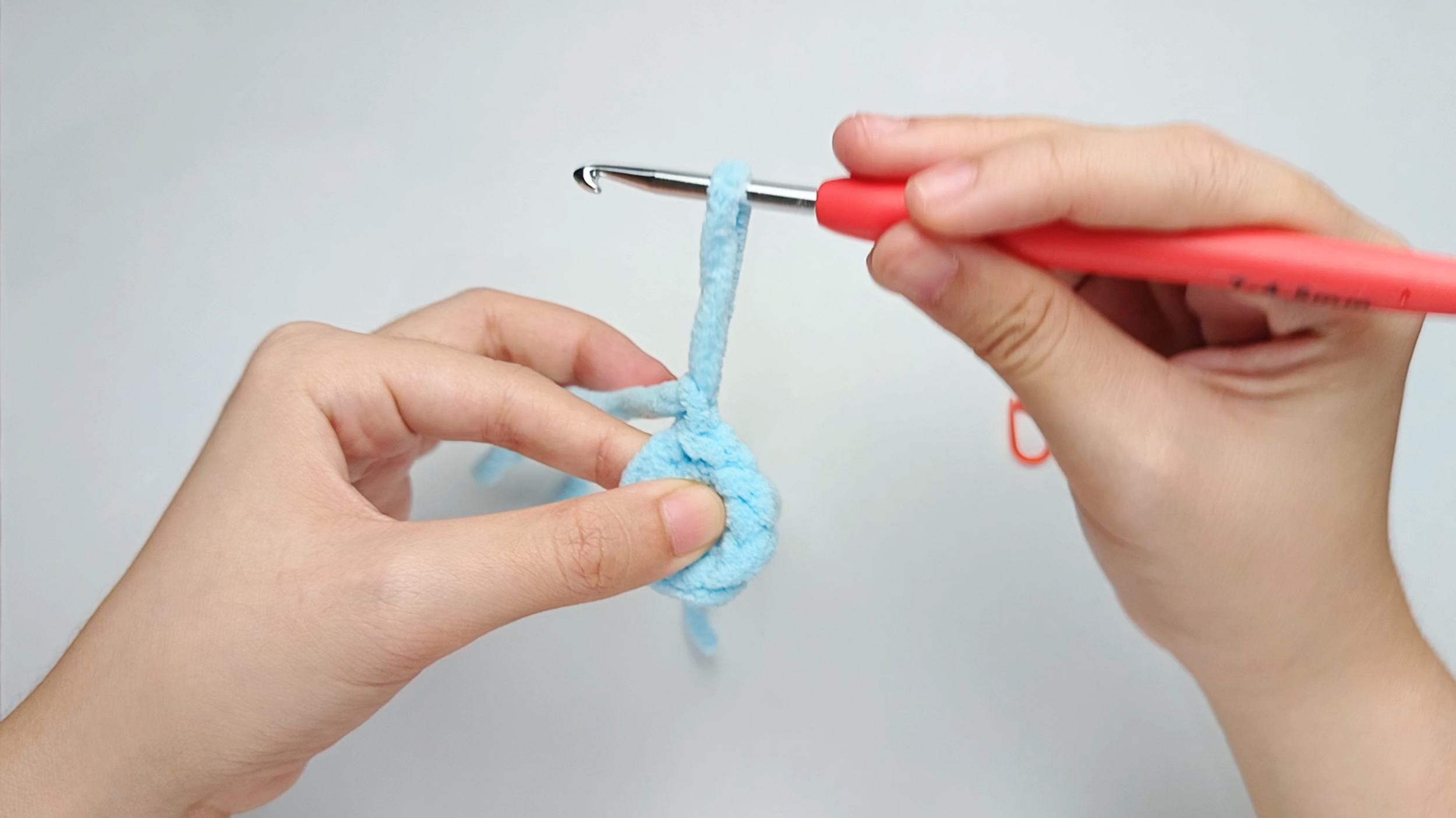 Yarn over and pull the yarn tail tight: Yarn over with the cut tail. Pull it all the way through that loop.