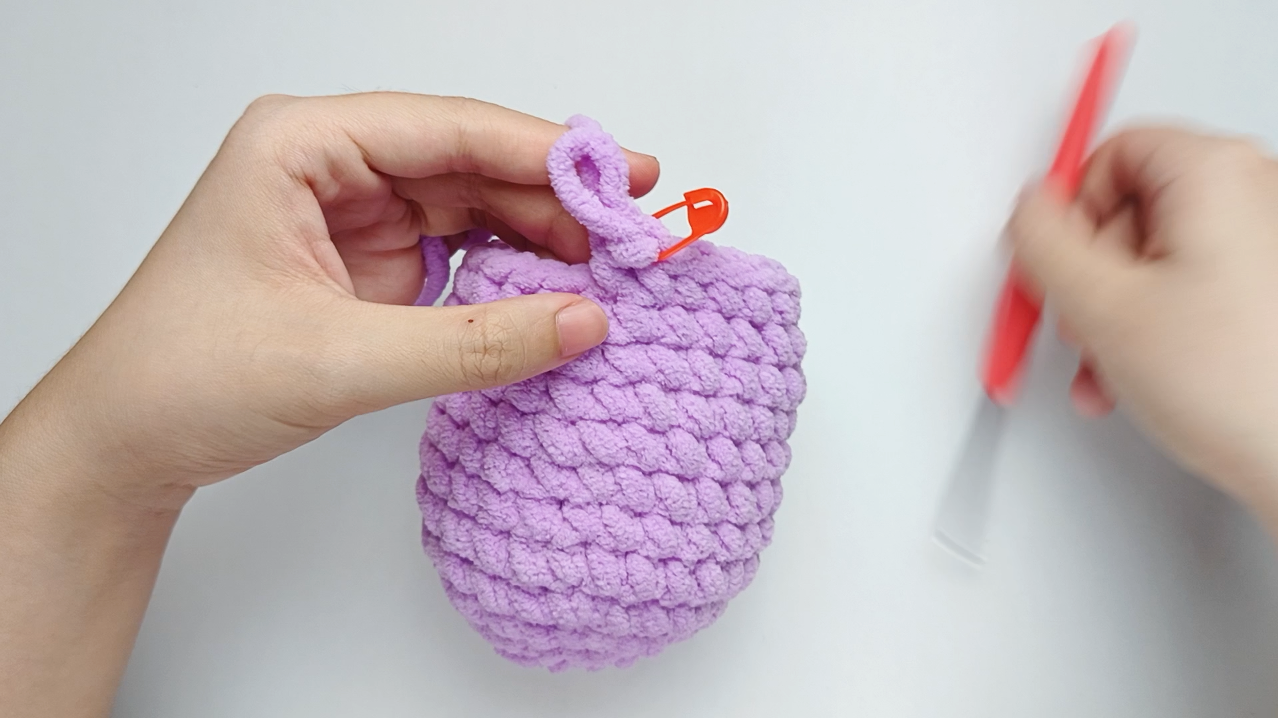 Mark the first stitch: Remove your hook for a moment, and use the stitch marker to mark this first stitch.