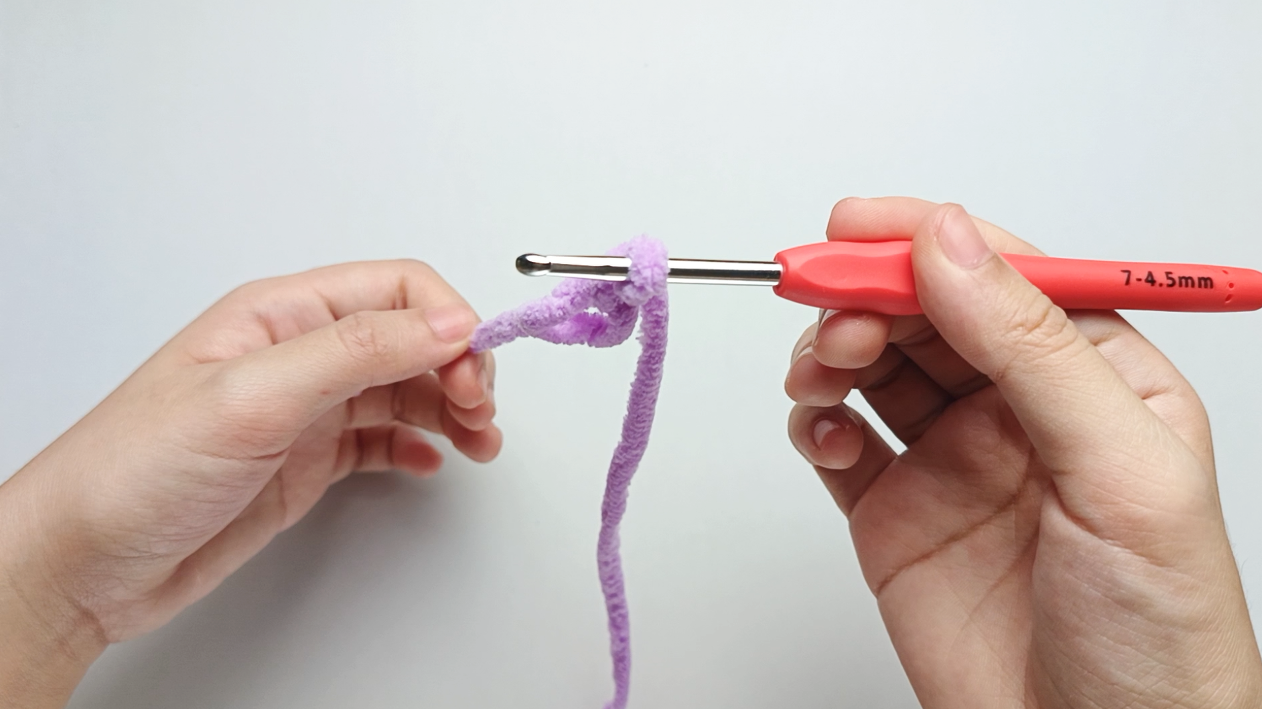 To check your magic ring formed correctly, gently pull the yarn tail. If the ring tightens neatly, you've made your magic ring (MR).