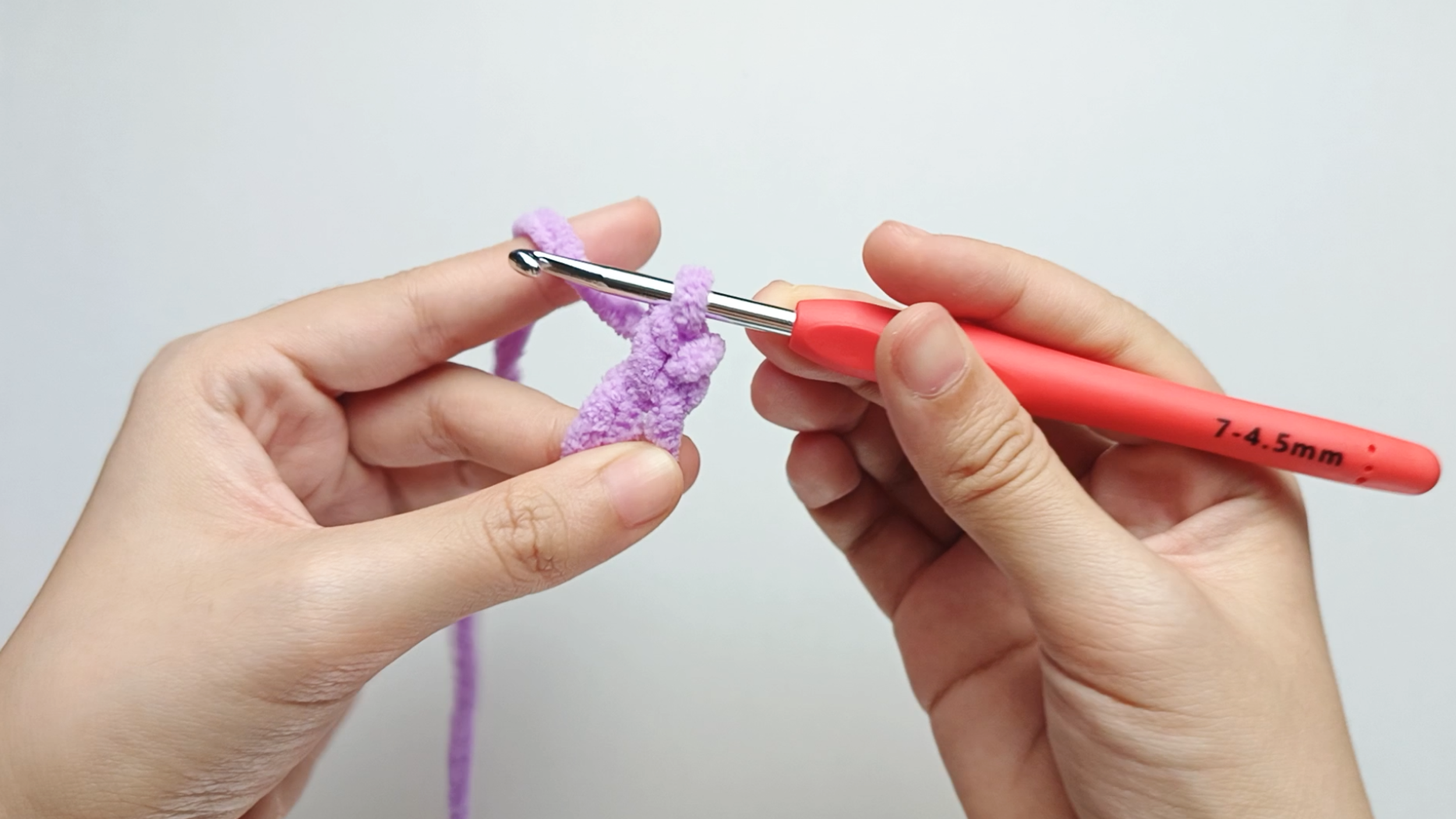 Finish the stitch: Yarn over once more and pull through both loops on your hook. You now have one loop left on the hook - that completes your first single crochet (sc) stitch.