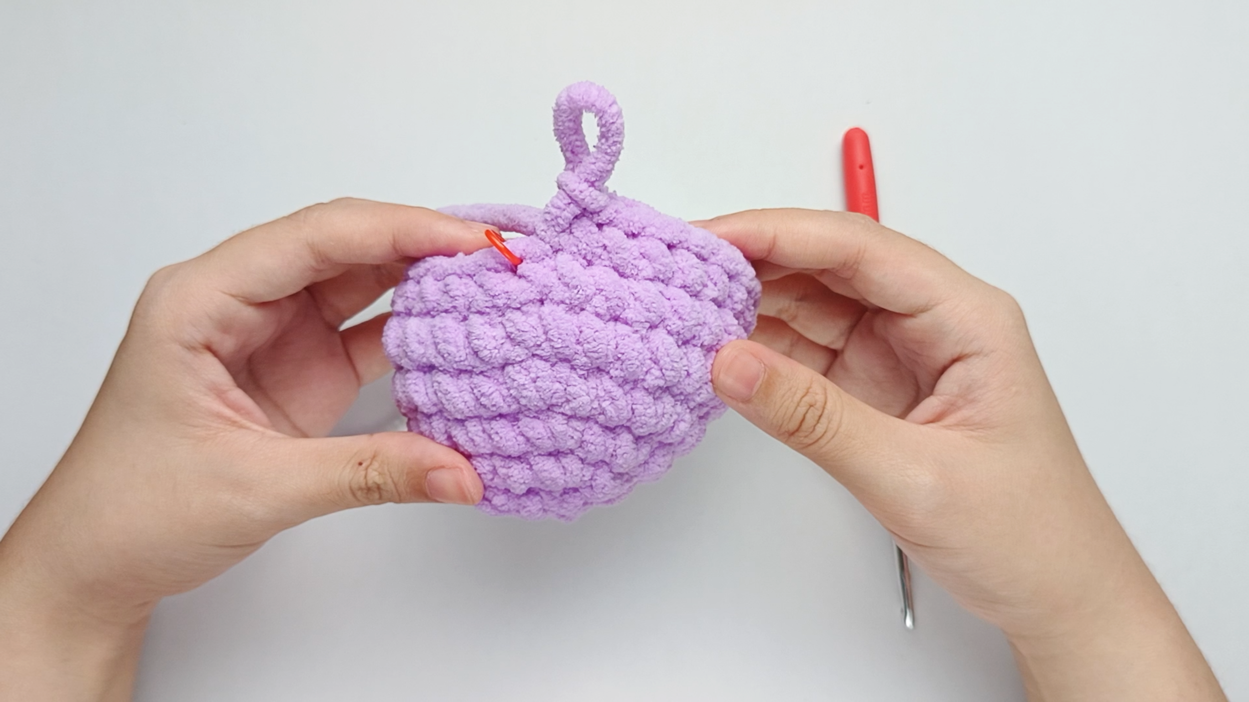 Make 9 purple single crochets (sc): Color change to purple and make 9 purple single crochets (sc).