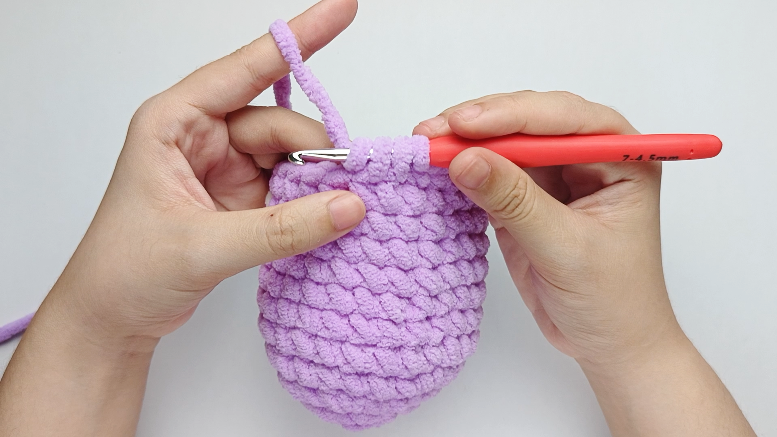 Yarn over once more: Wrap the yarn over your hook one more time.
