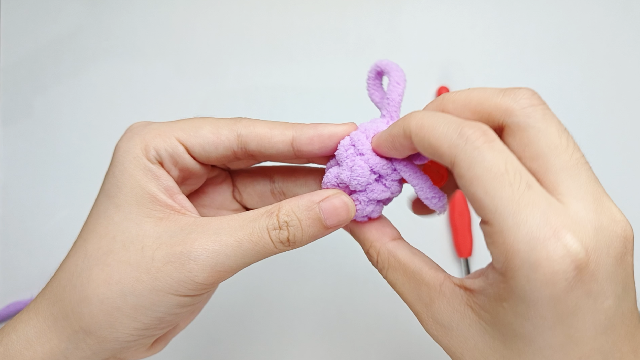 Hide the yarn tail: Hide the yarn tail from the magic ring (MR) inside the Wing.