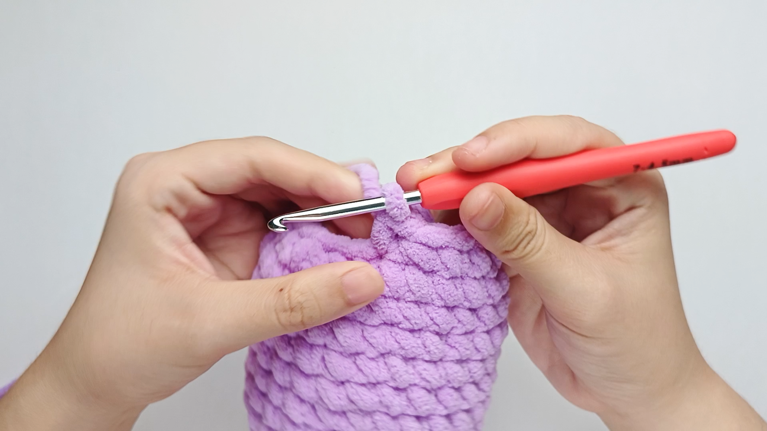 Make 1 single crochet (sc) first: Yarn over, pull through, yarn over again, and pull through both loops.