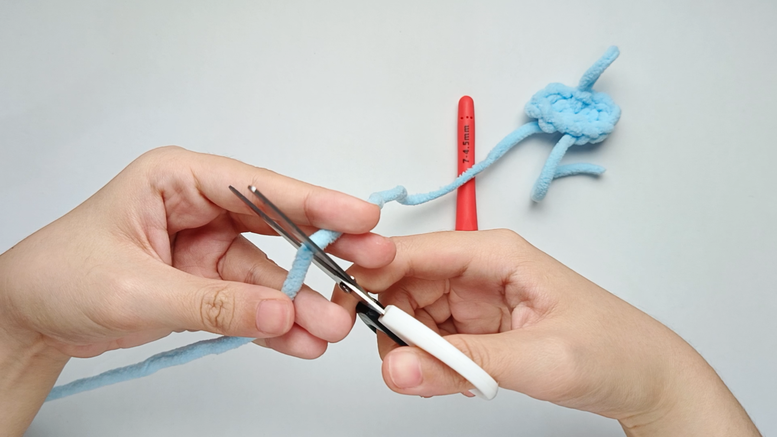 Fasten off (FO): Cut the yarn, leaving about a 6-inch tail. You’ll use this yarn tail later to sew the Bow onto the Body.