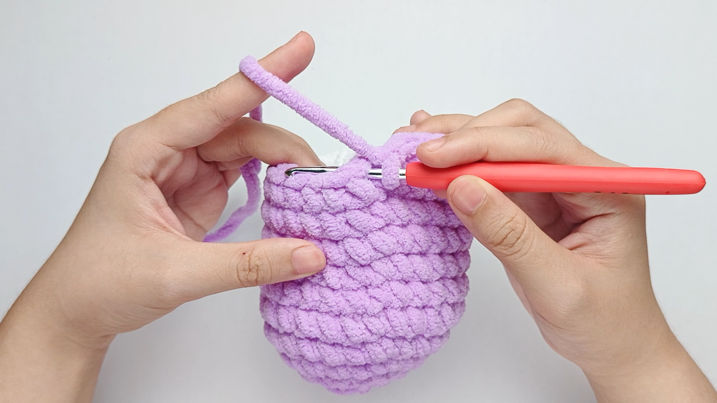 Hook back in: Insert your hook into that marked stitch to begin Round 12. Remove the stitch marker so the stitch is easier to work into.