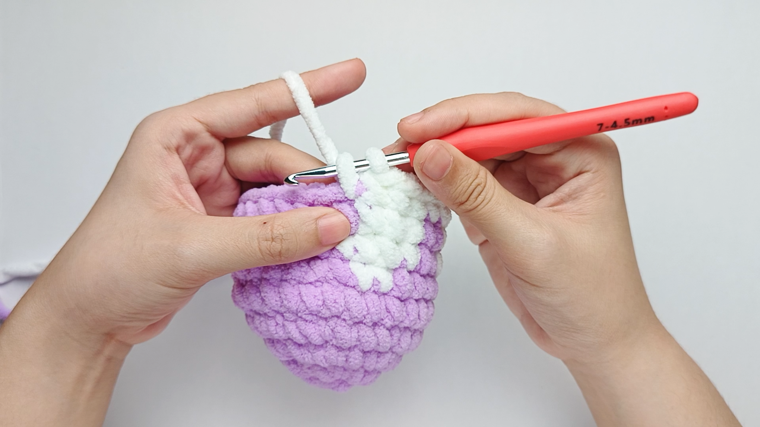 Make 10 white single crochets (sc): Color change to white, make 10 white single crochets (sc), and stop just before the final yarn over.
