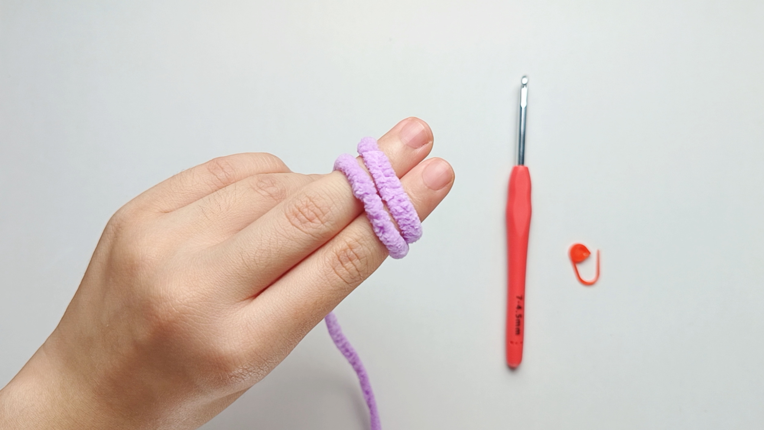 Turn your hand over: Turn your hand so your palm faces down. You'll now see two parallel strands stretched across your index and middle fingers.