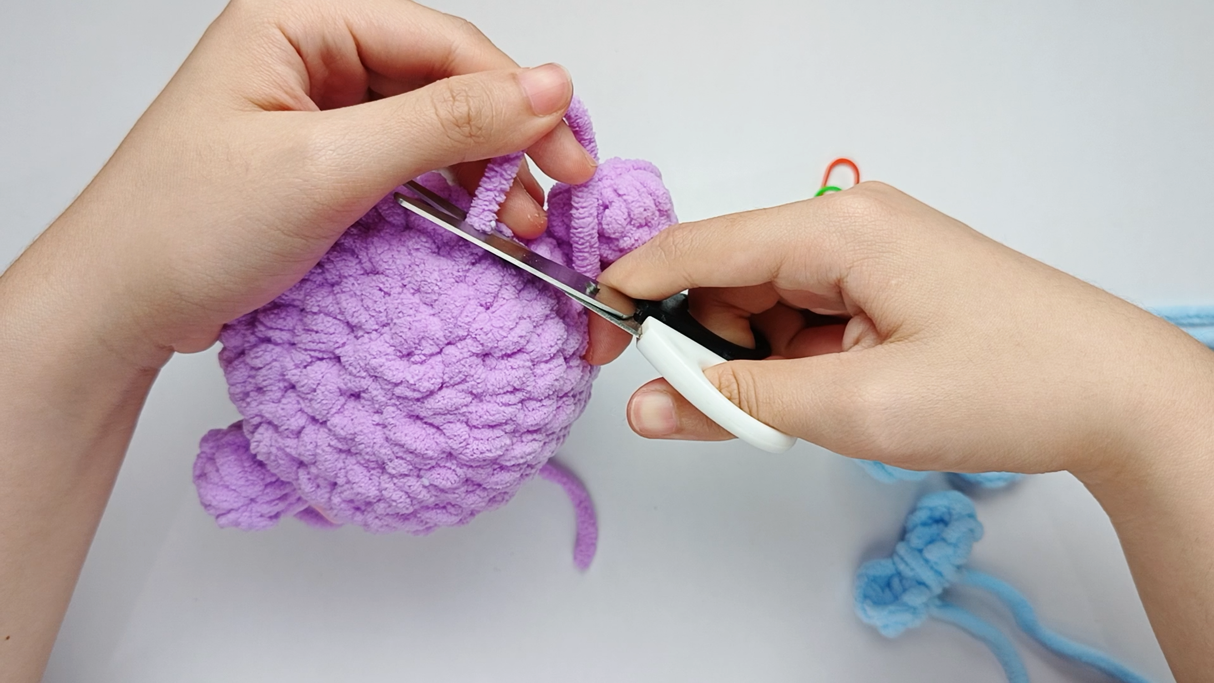 Trim the tail: Trim the tail close to the surface and gently massage the area so the end disappears inside.