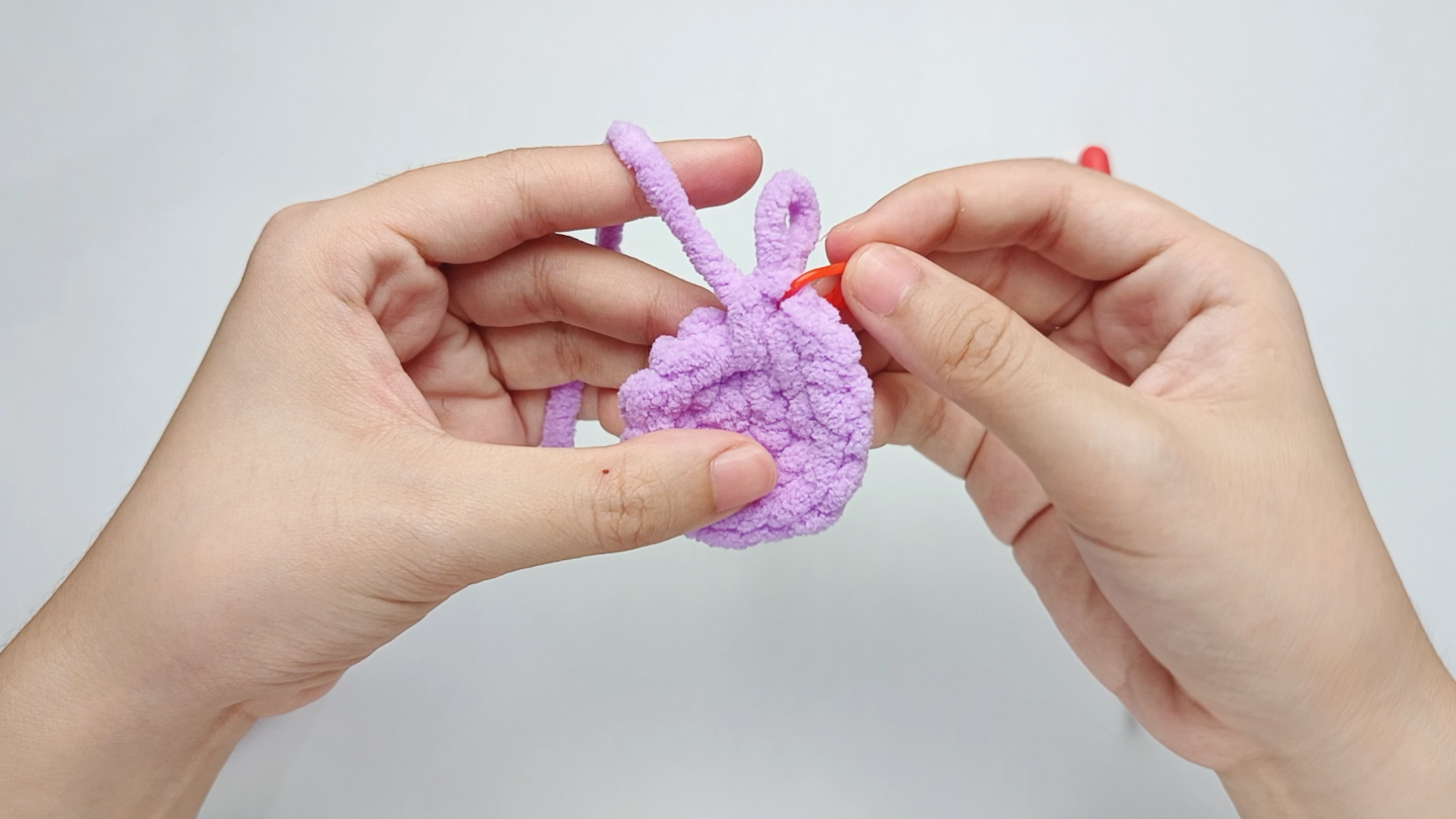 Mark the first stitch: Remove your hook for a moment, and use the stitch marker to mark this first stitch.