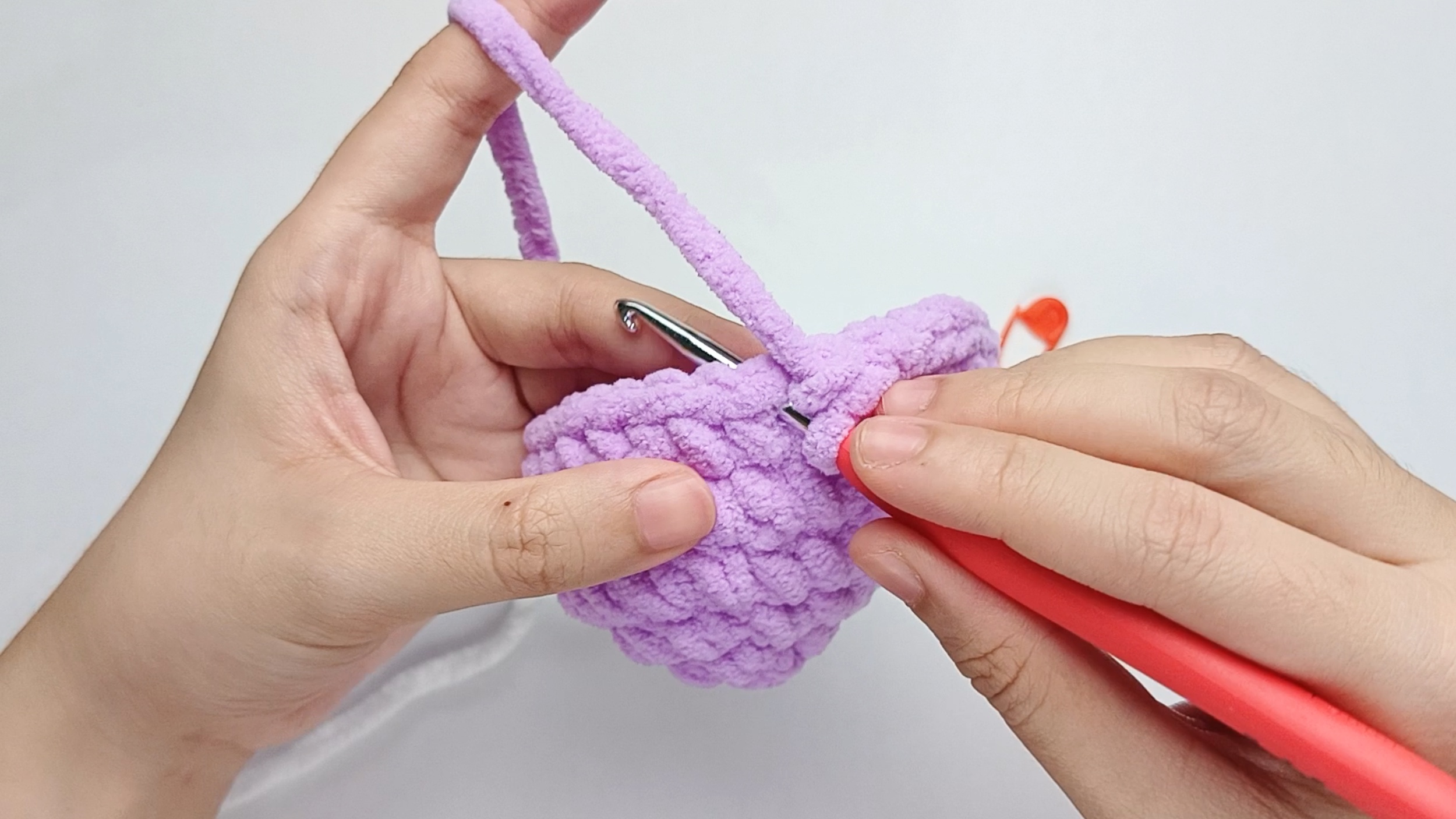 Hook back in: Insert your hook into that marked stitch to begin Round 7. Remove the stitch marker so the stitch is easier to work into.
