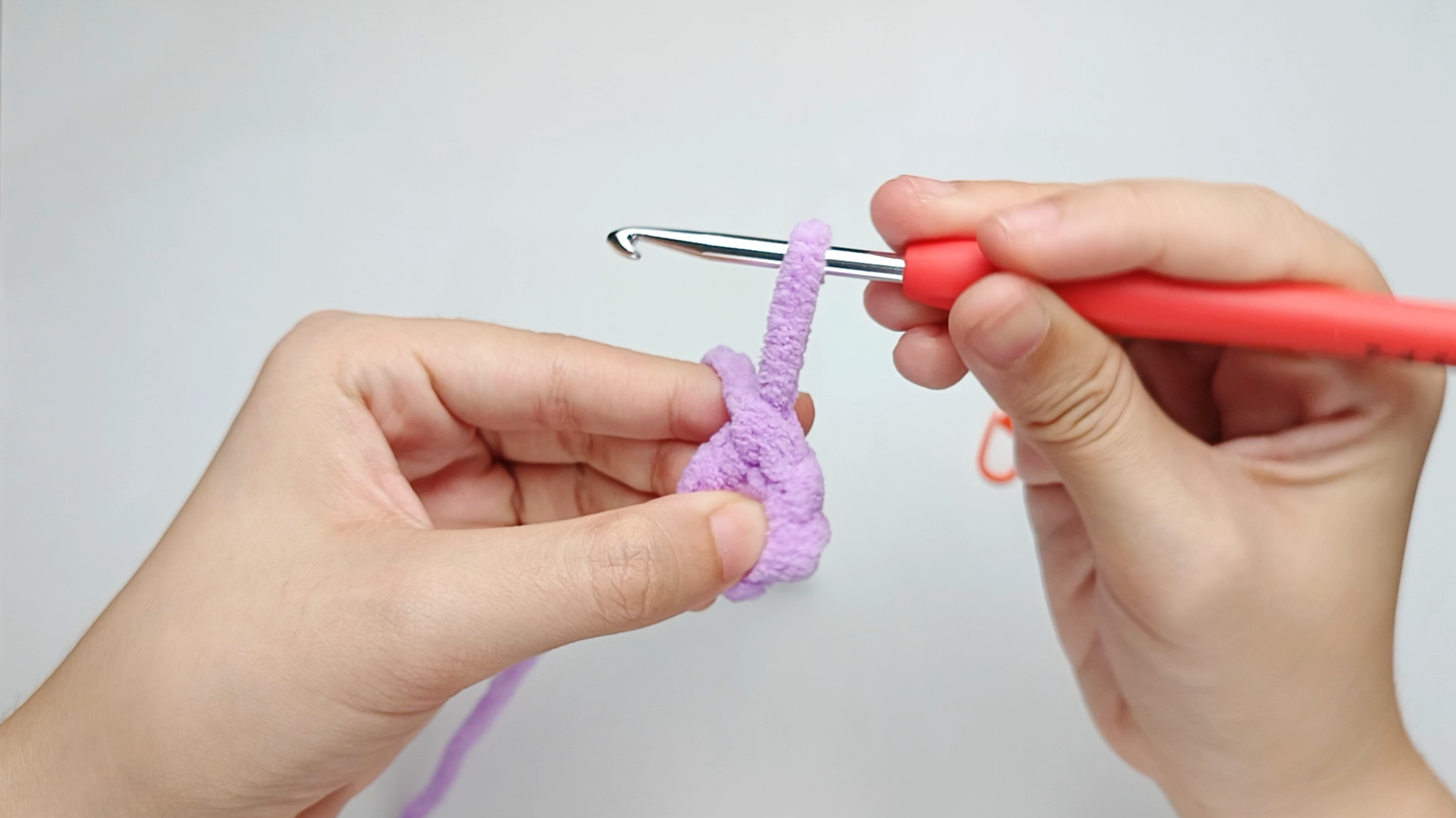 Make 1 single crochet (sc) first: Yarn over, pull through, yarn over again, and pull through both loops.