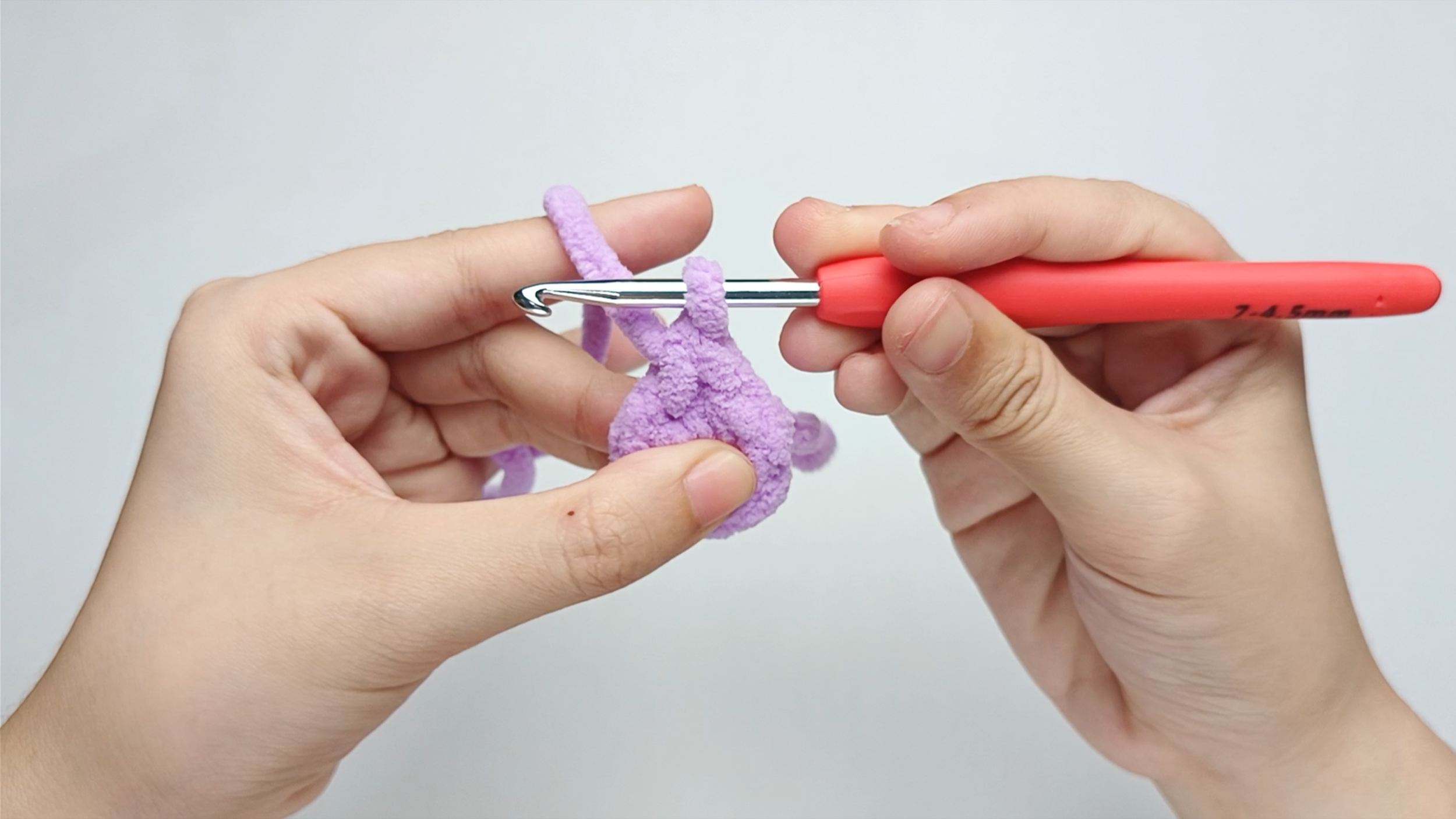 Pull through both: Pull the yarn through both loops on your hook. You should now have one loop left. That is your first single crochet (sc).