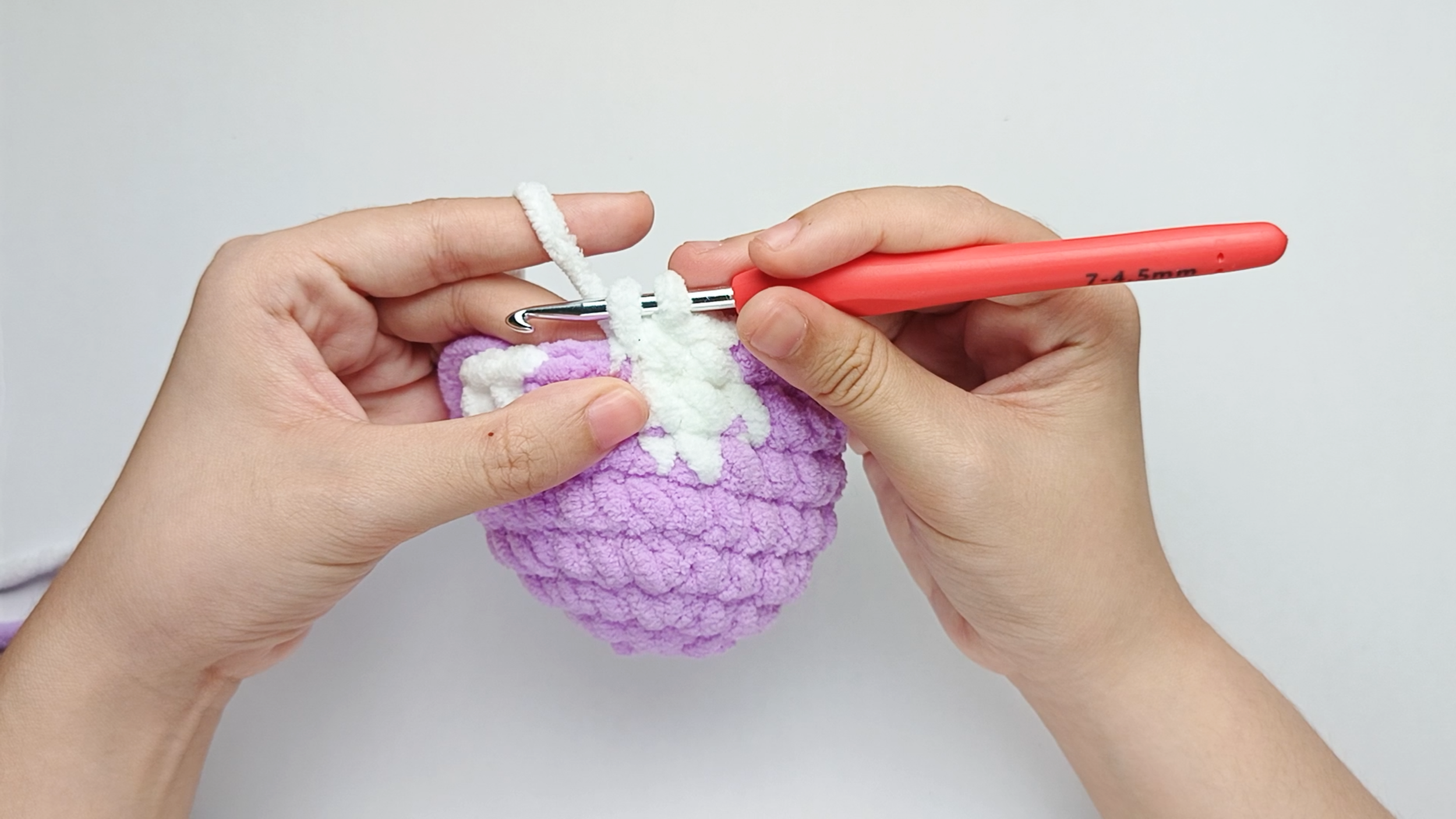 Make 3 white single crochets (sc): Color change to white, make 3 white single crochets (sc), and stop just before the final yarn over.