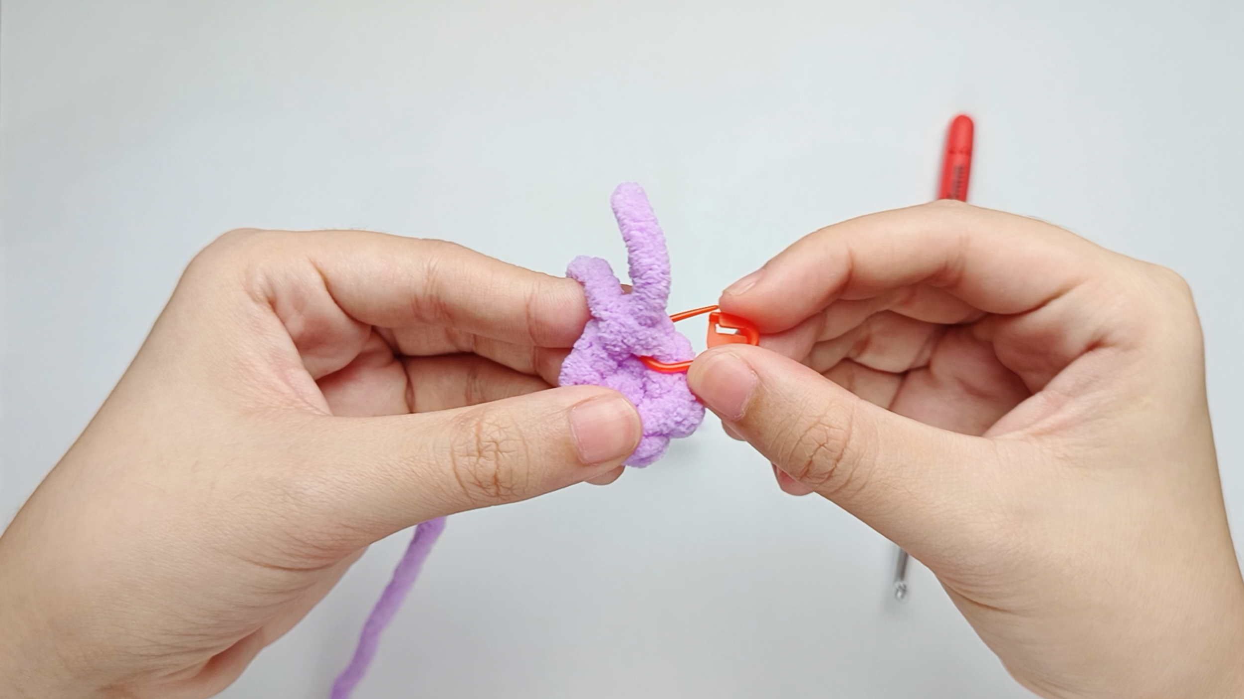 Mark the first stitch: Remove your hook for a moment, and use the stitch marker to mark this first stitch.