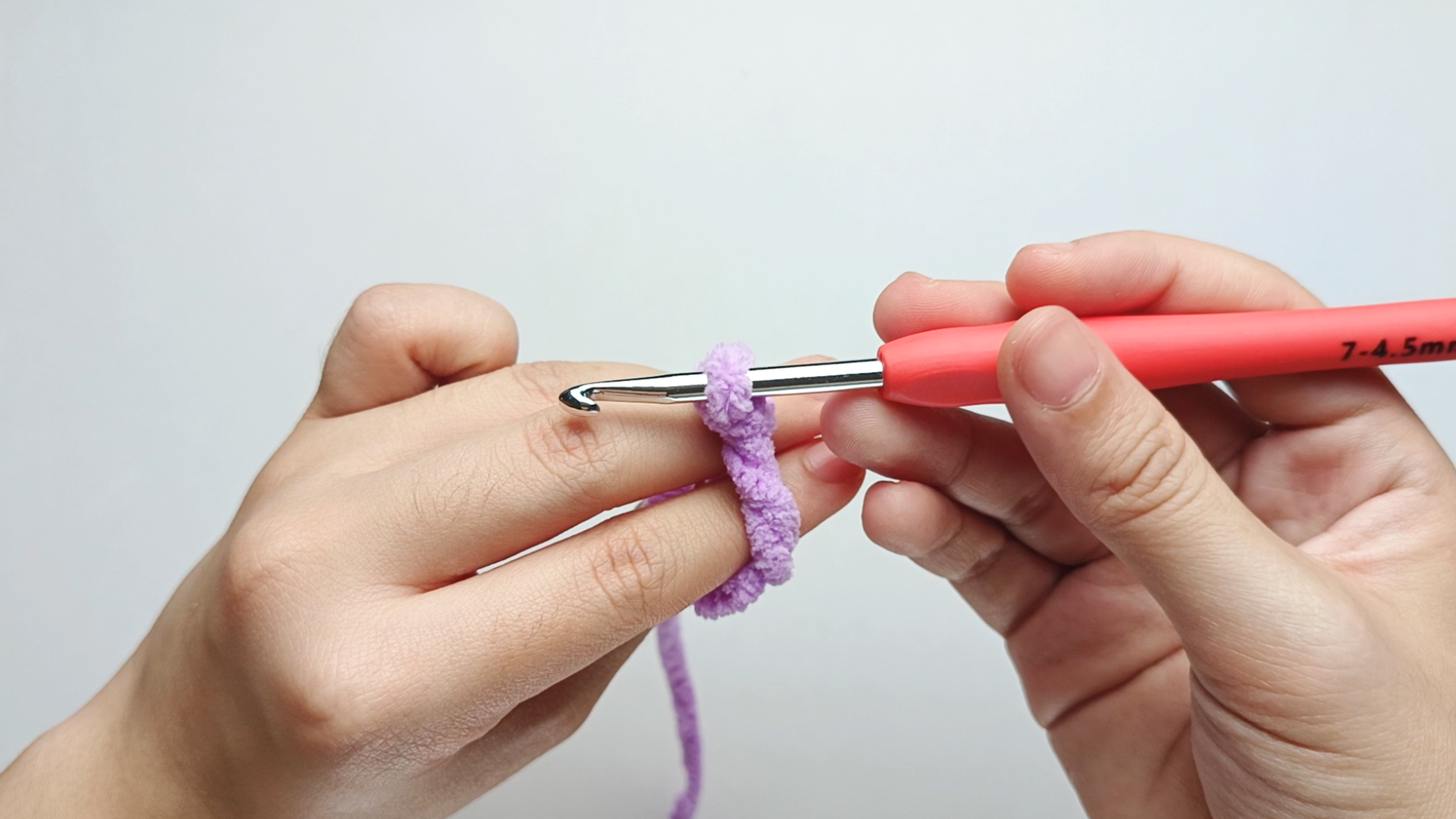 Pull through: Gently pull the yarn through the ring on your hook. You now have one loop on your hook.