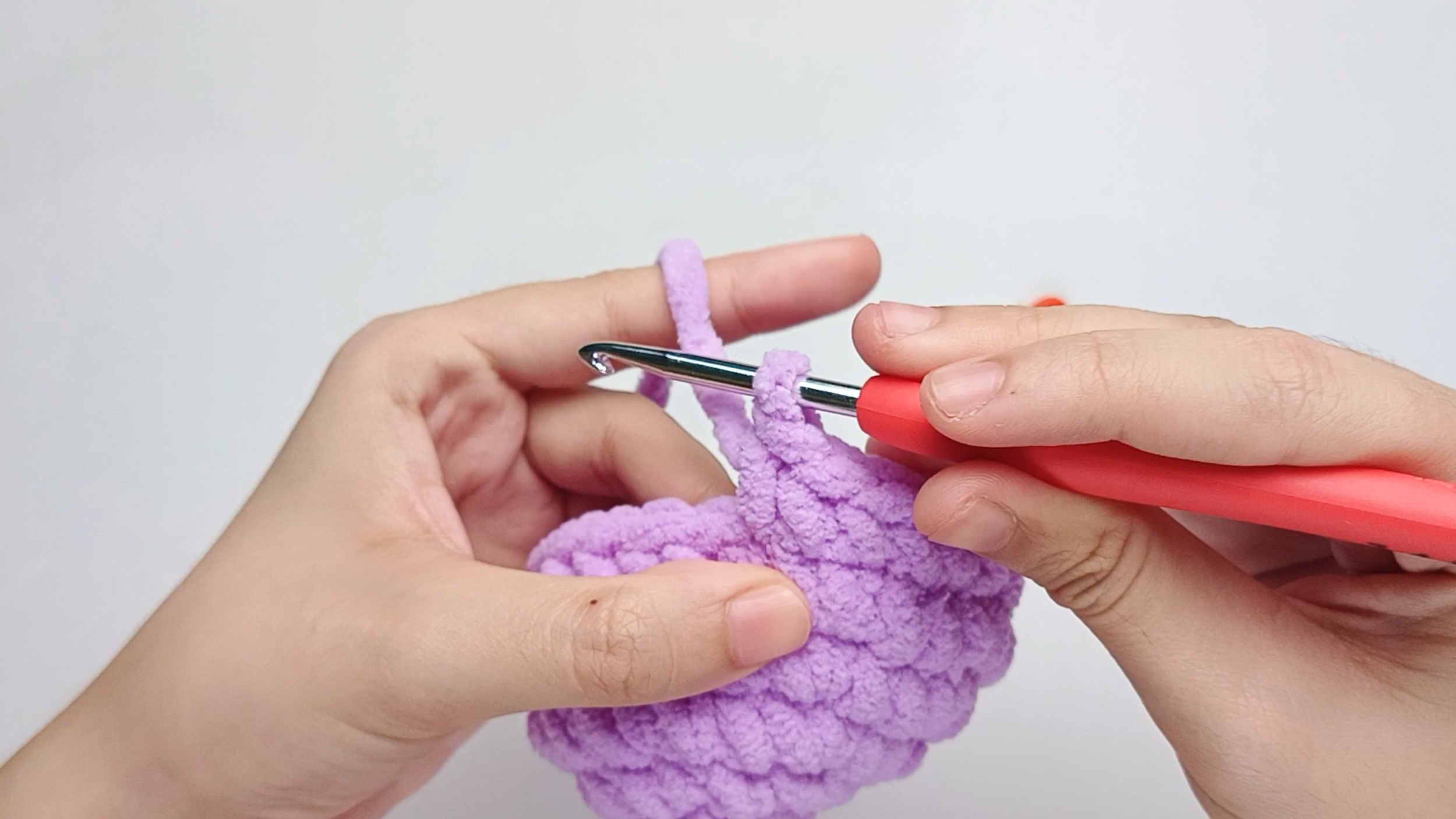 Make 1 single crochet (sc) first: Yarn over, pull through, yarn over again, and pull through both loops.