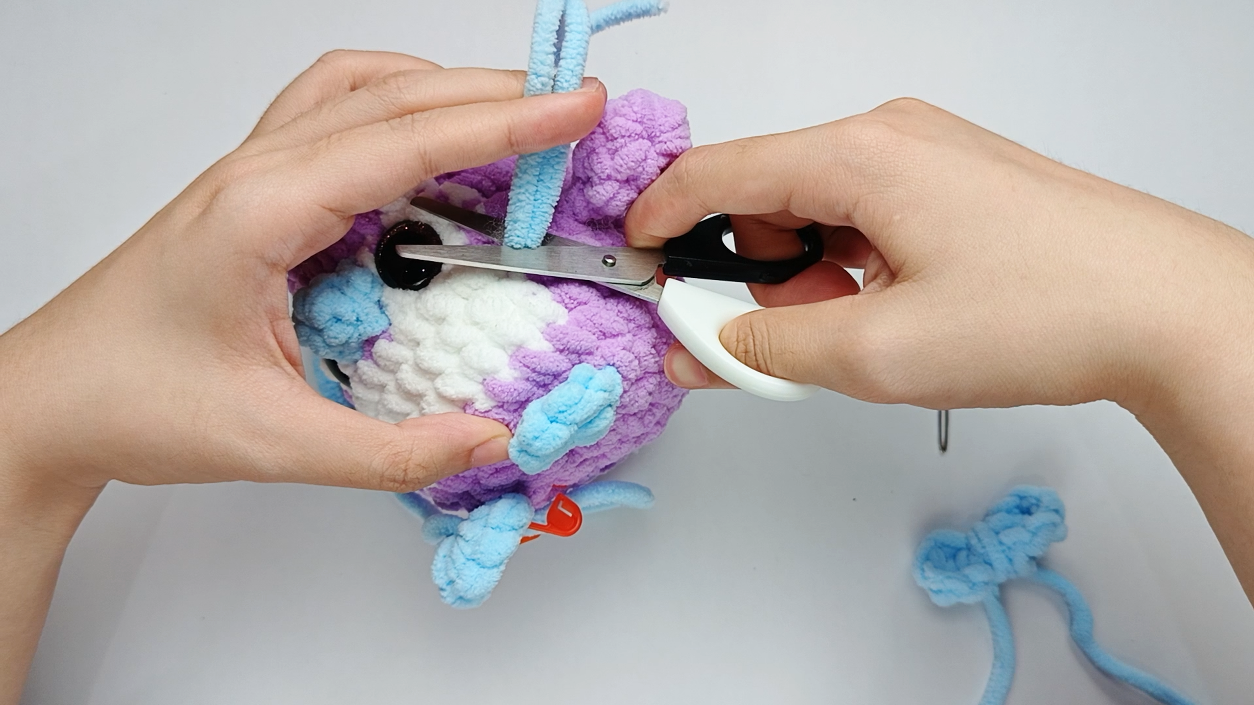 Trim the tails: Trim the tails close to the surface and gently massage the area so the end disappears inside.