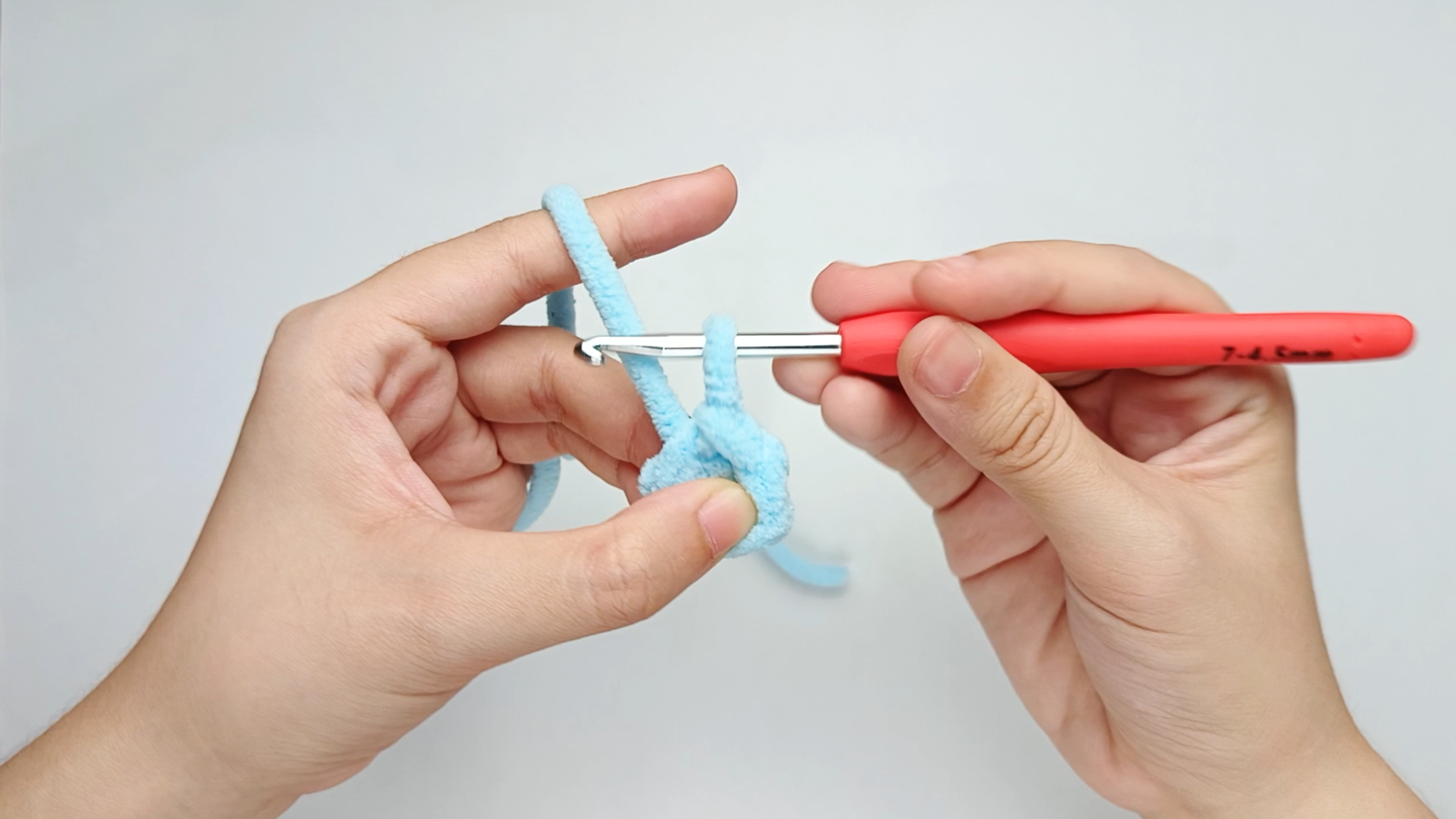 Pull through the new loop: Pull the new loop through the other one on your hook. You should now have one loop left — and that completes one slip stitch.