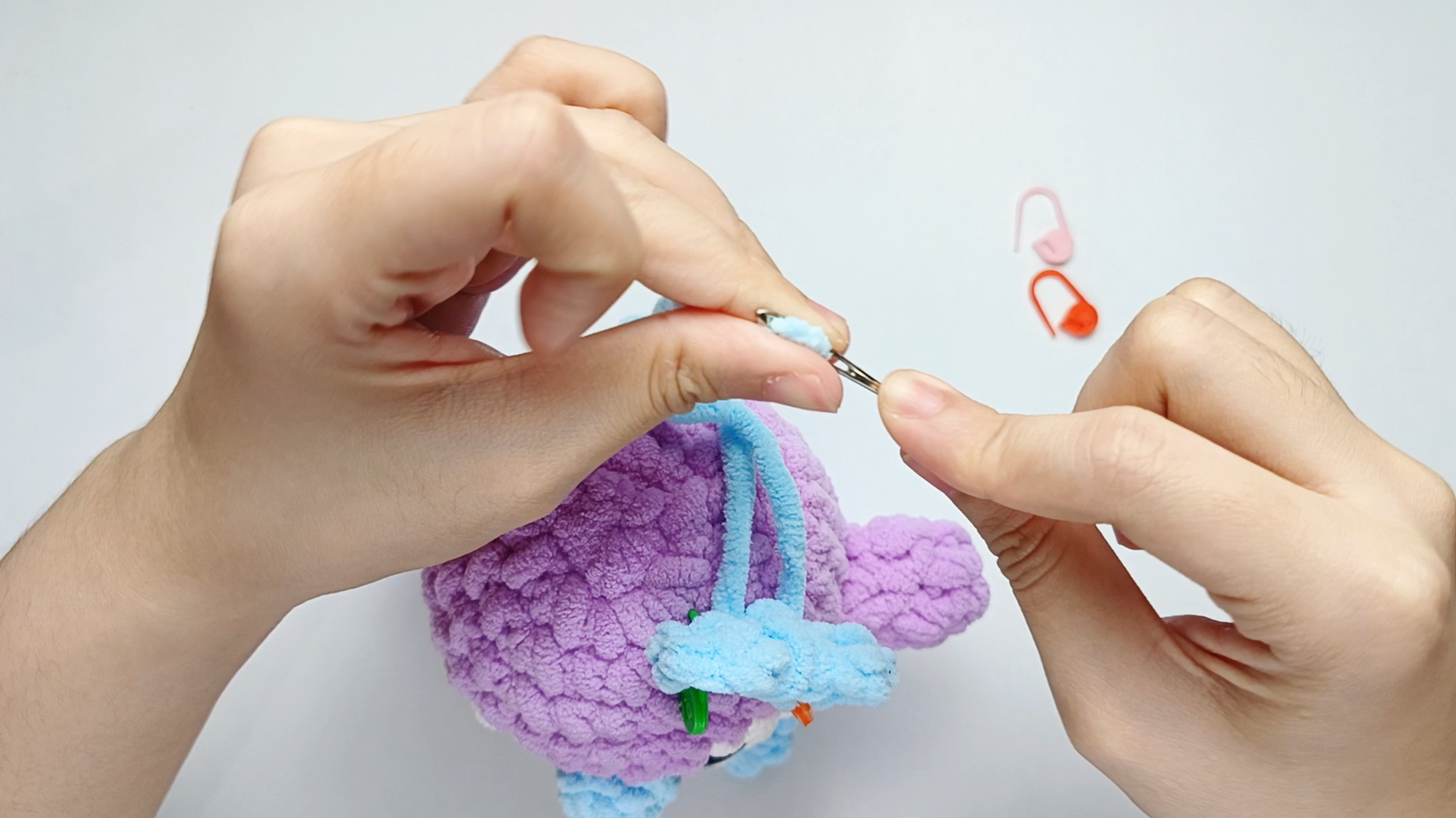 Thread the needle: Thread the yarn tail from the Bow onto your yarn needle.