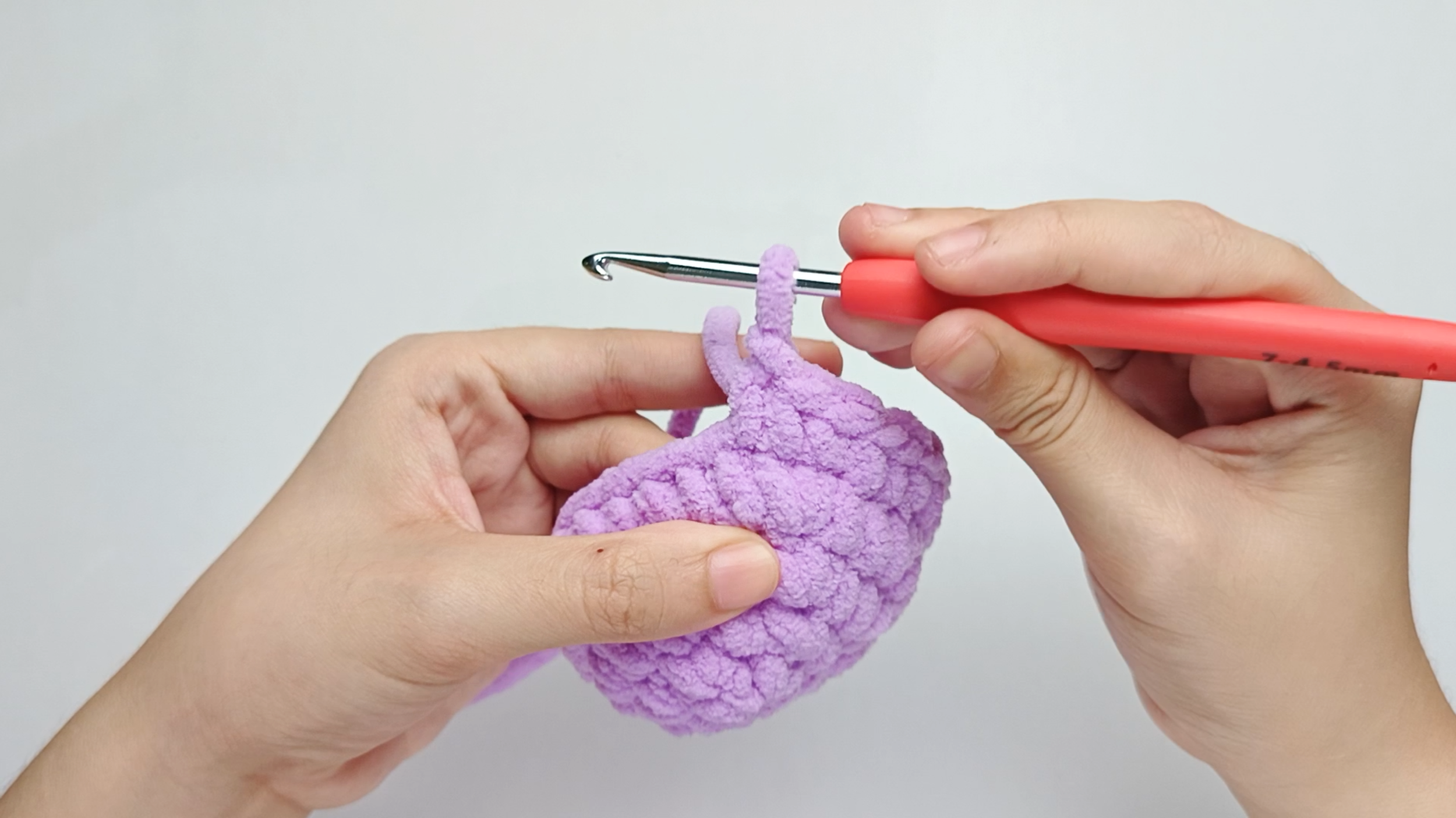Make 1 single crochet (sc) first: Yarn over, pull through, yarn over again, and pull through both loops.