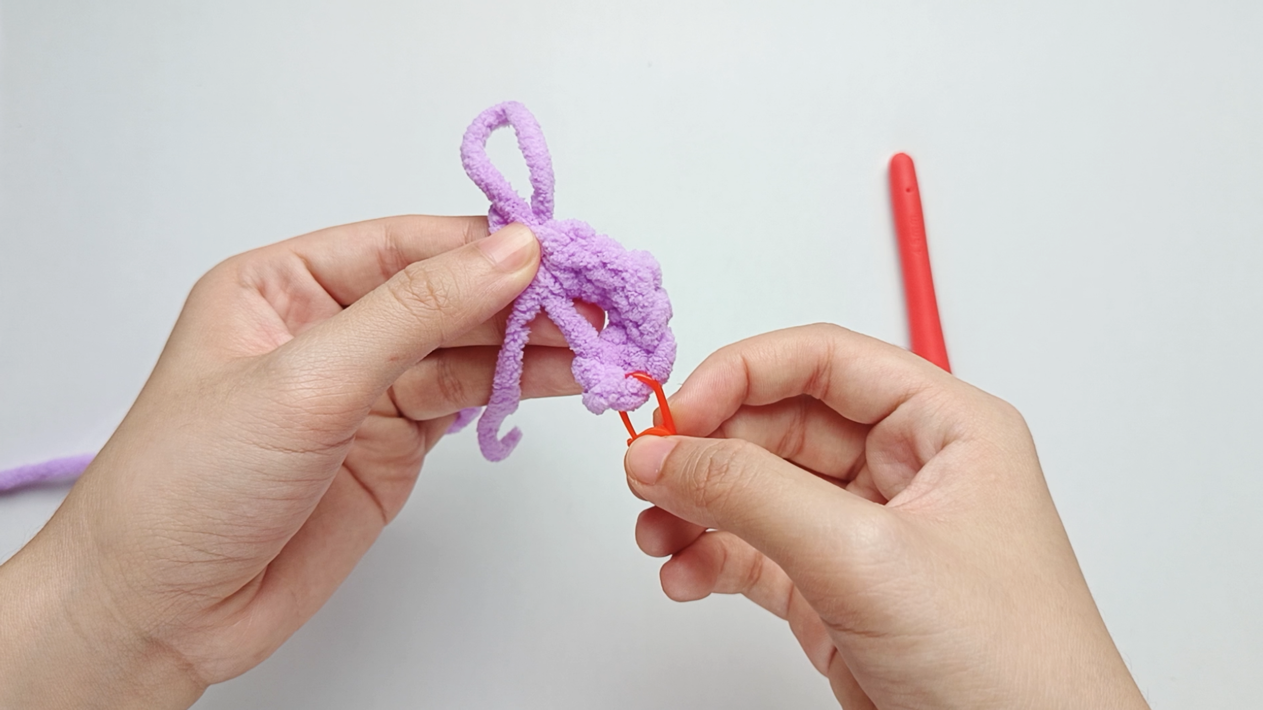 Make all your stitches: Hook in, yarn over and pull through, then finish the stitch — repeat until you've made all 7 single crochet (sc).