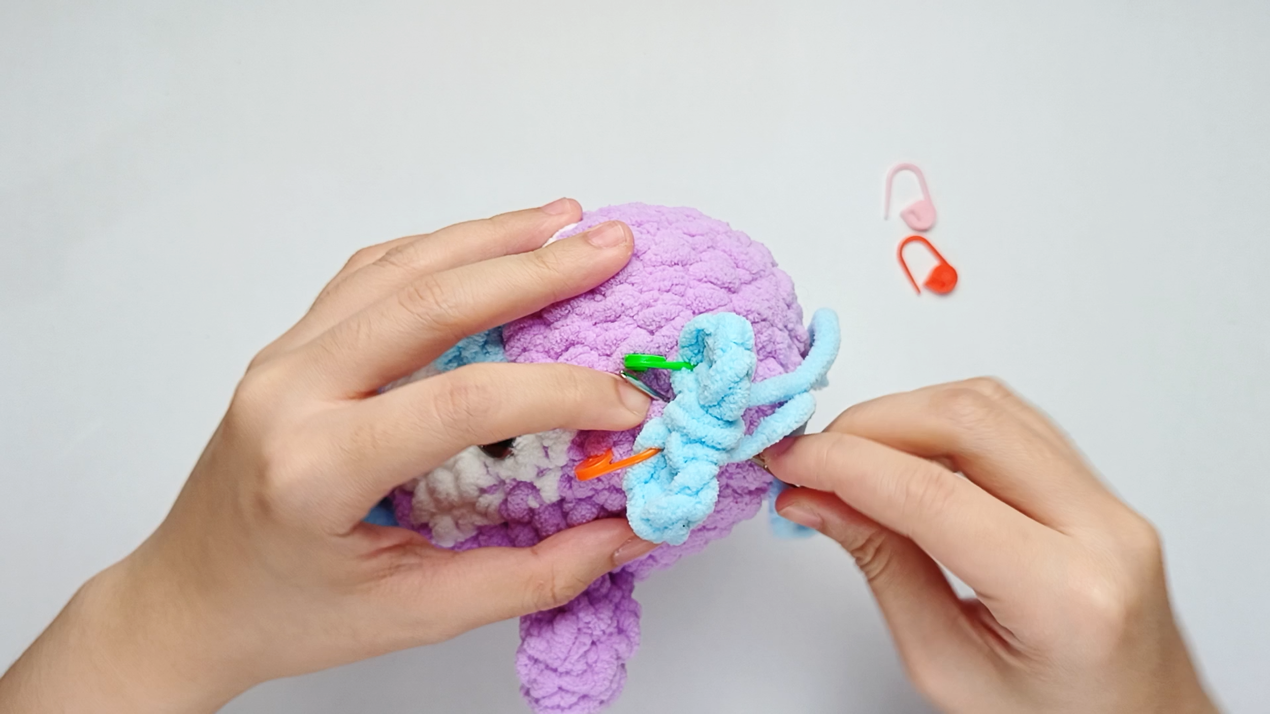 Into the Body: Insert the needle into one stitch of the Body, lining it up with the next stitch on the piece. Pull the yarn all the way through.