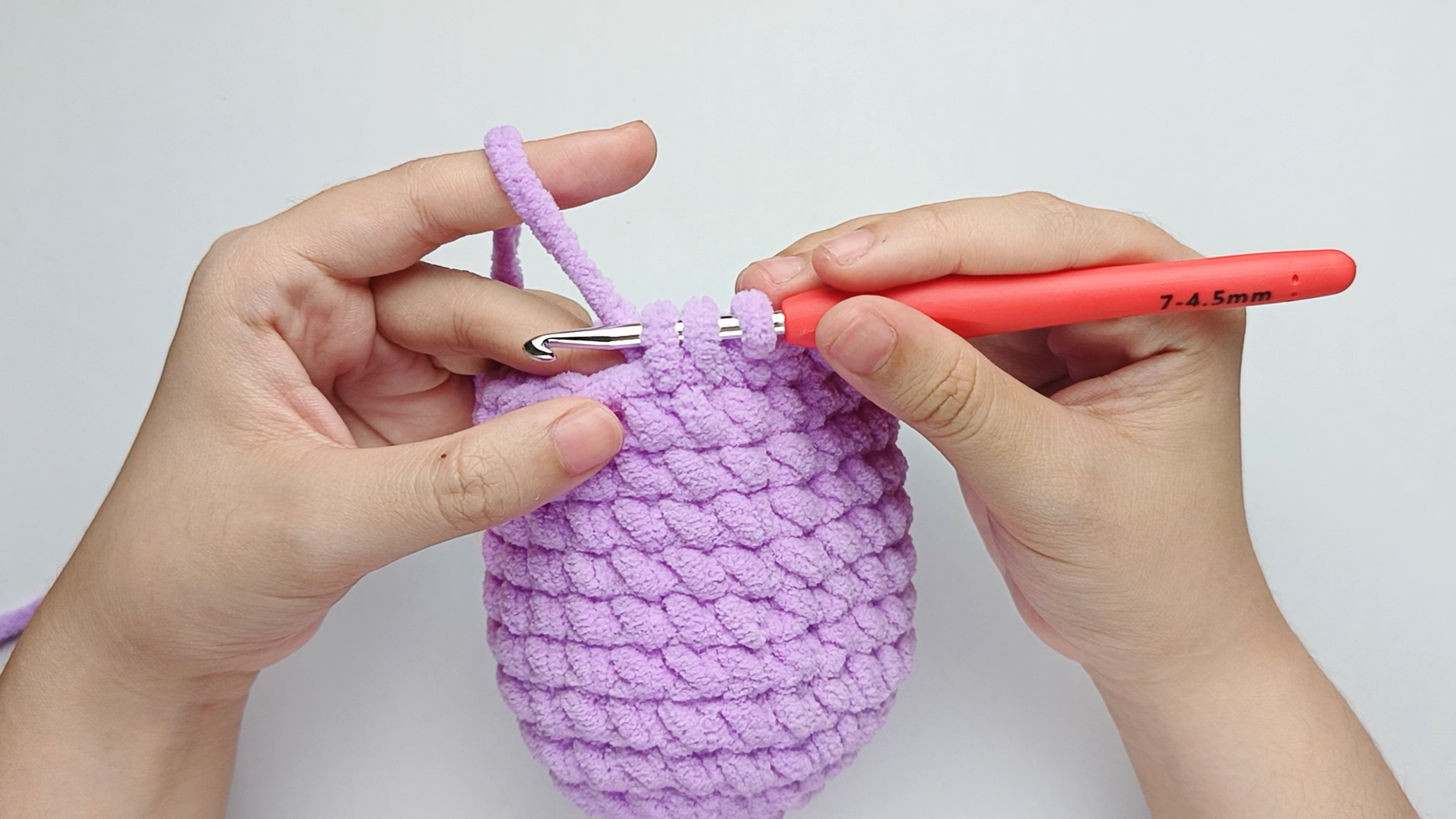 Add another single crochet (sc): Make another single crochet (sc) in the next stitch the same way. You'll now have three loops on your hook.