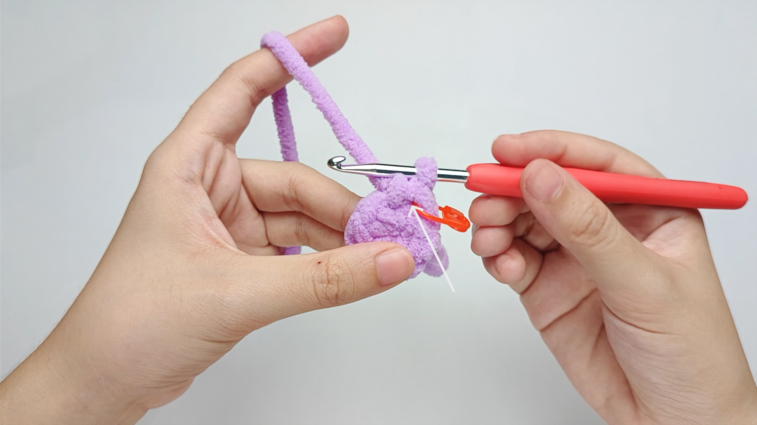 Find the same hole: Find the hole where you just made that stitch - it's right under the bottom of the vertical “V” you created.