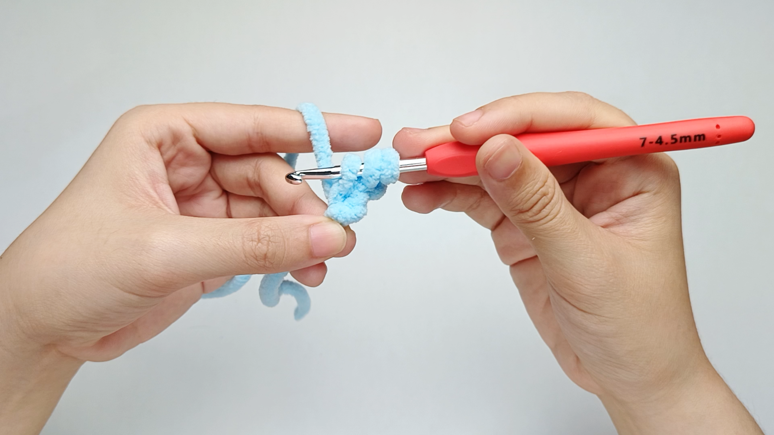 Pull through the stitch: Pull the yarn through the stitch. You should now have three loops on your hook.