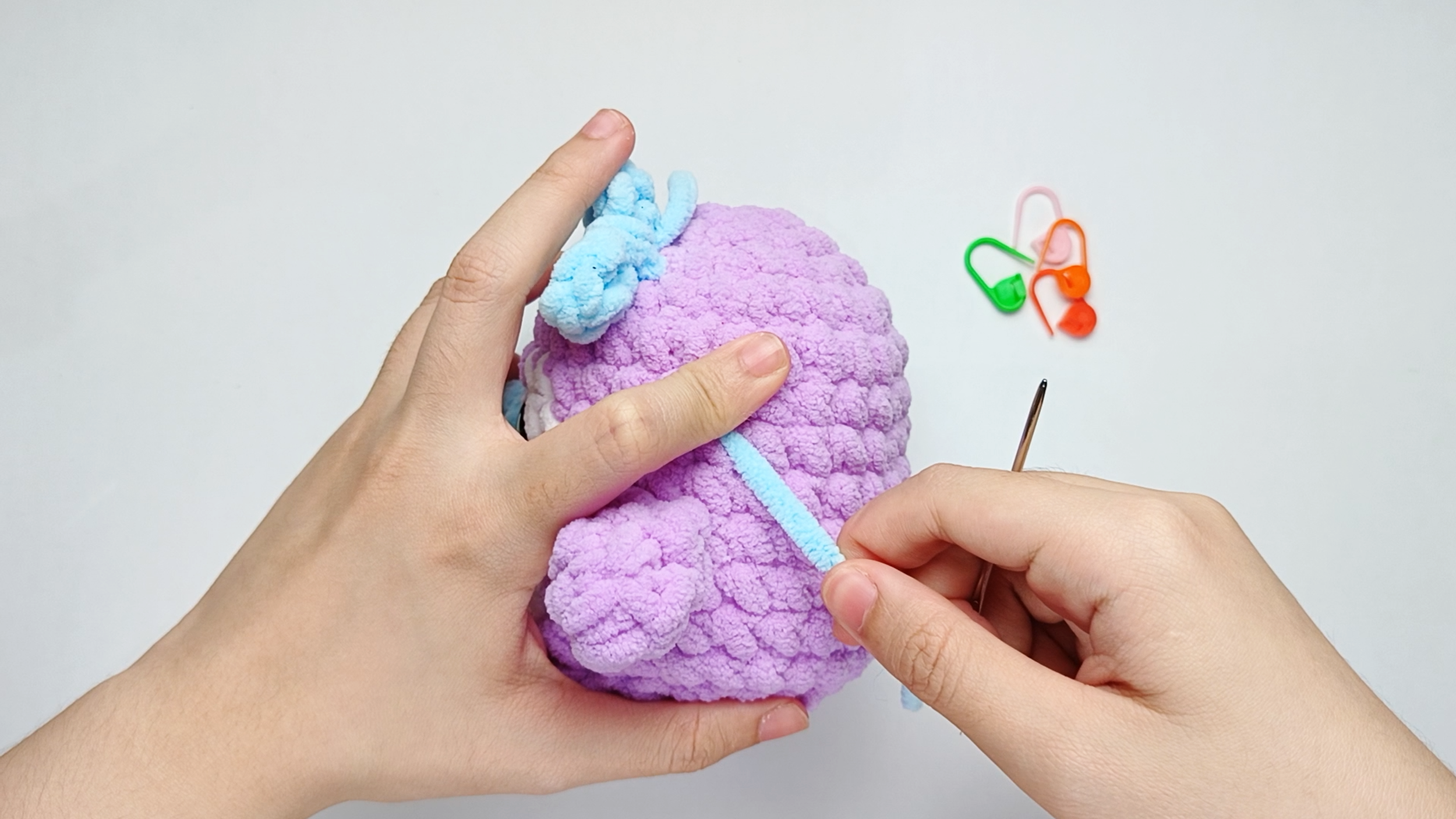 Secure and hide the tail: To hide the yarn tail, take the needle down into the next stitch and run it through the Body, then pull the yarn through.